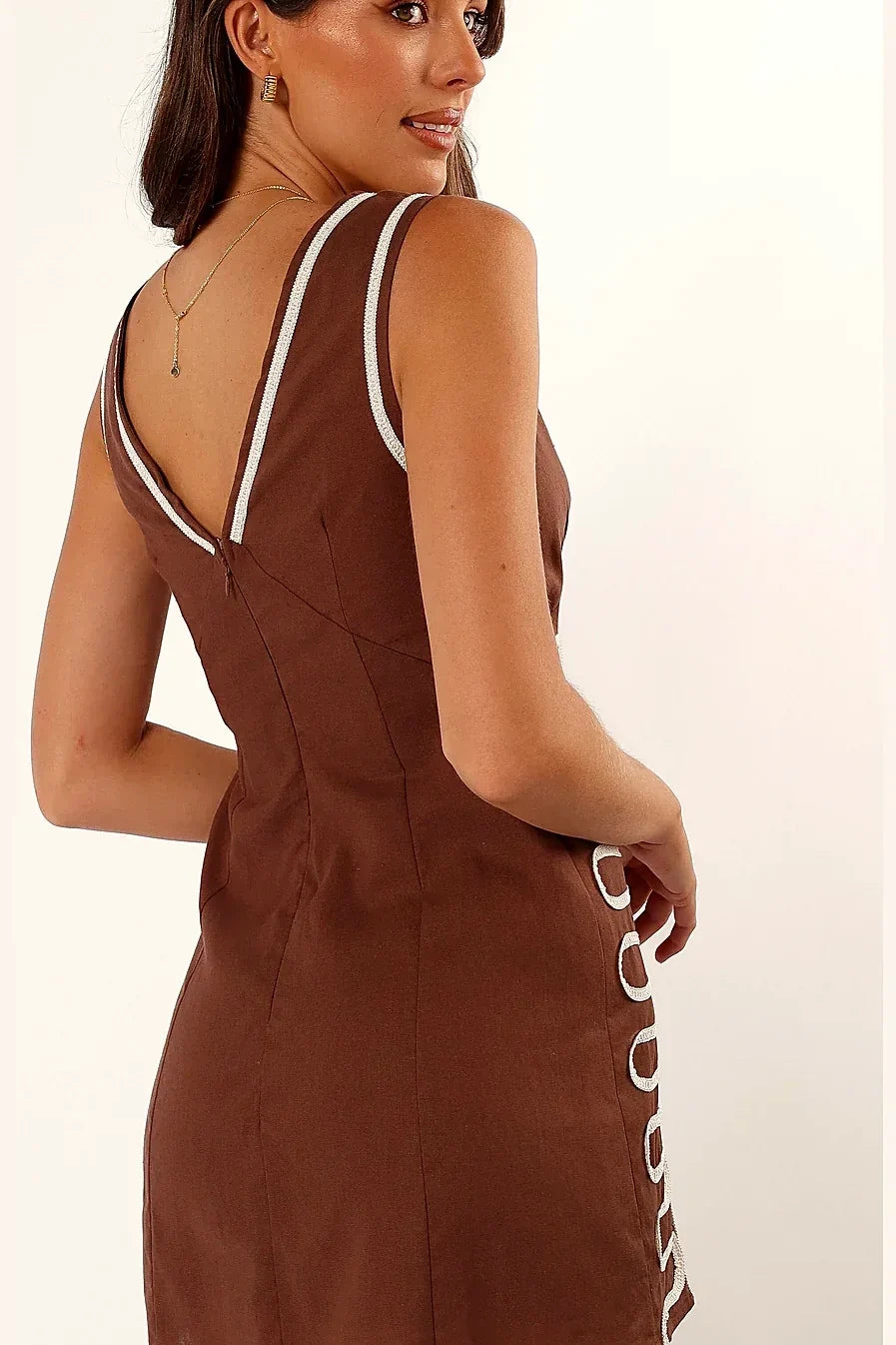Embroidery detail on the chocolate brown linen dress