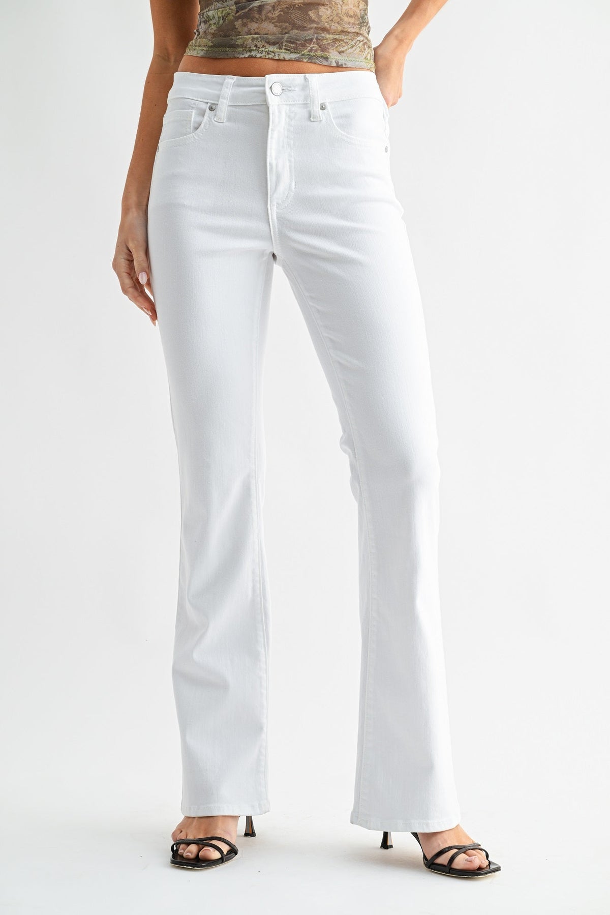 Mid rise waist on a polished black bootcut jean