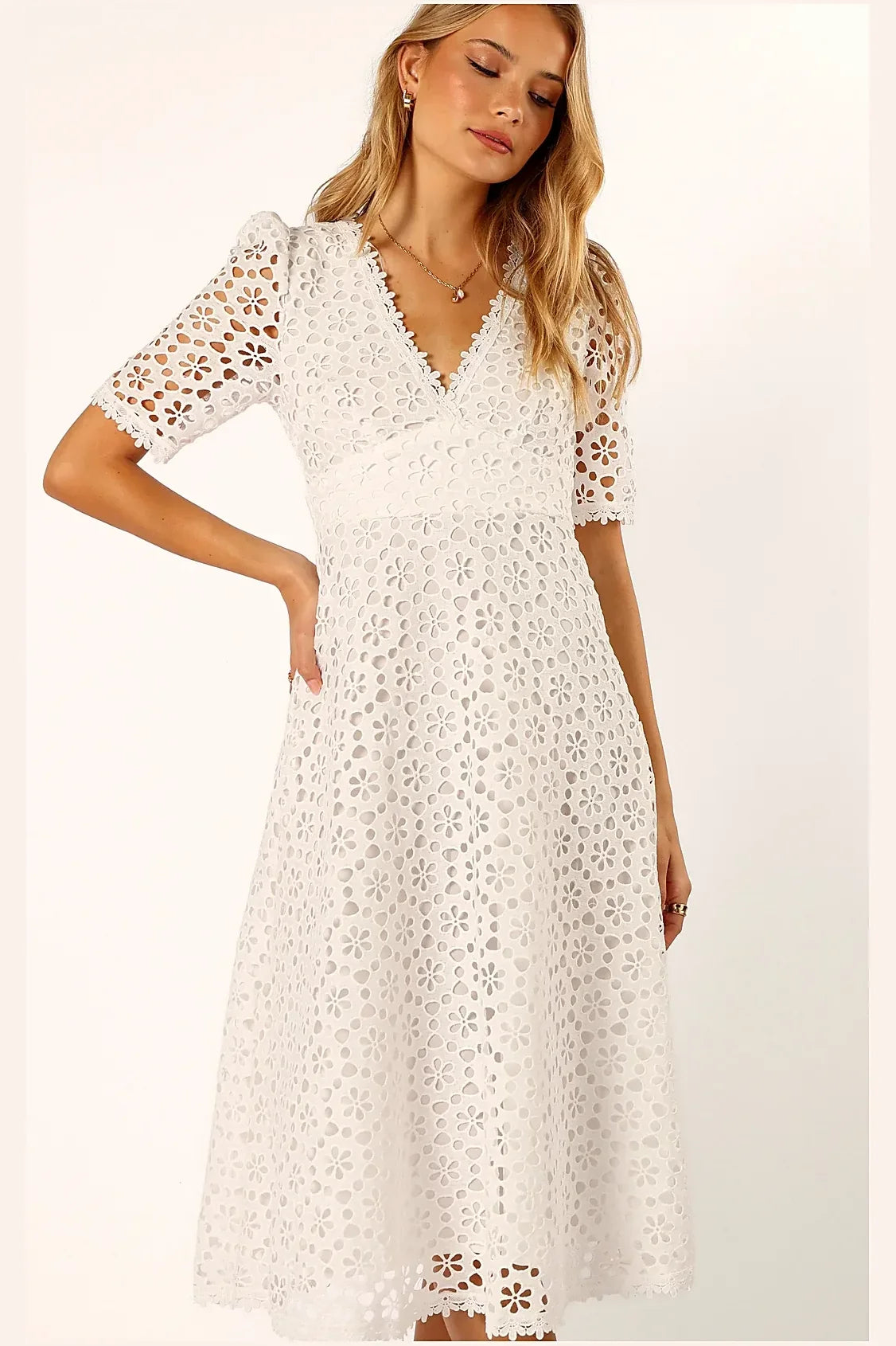 White anglaise midi dress photographed from the side