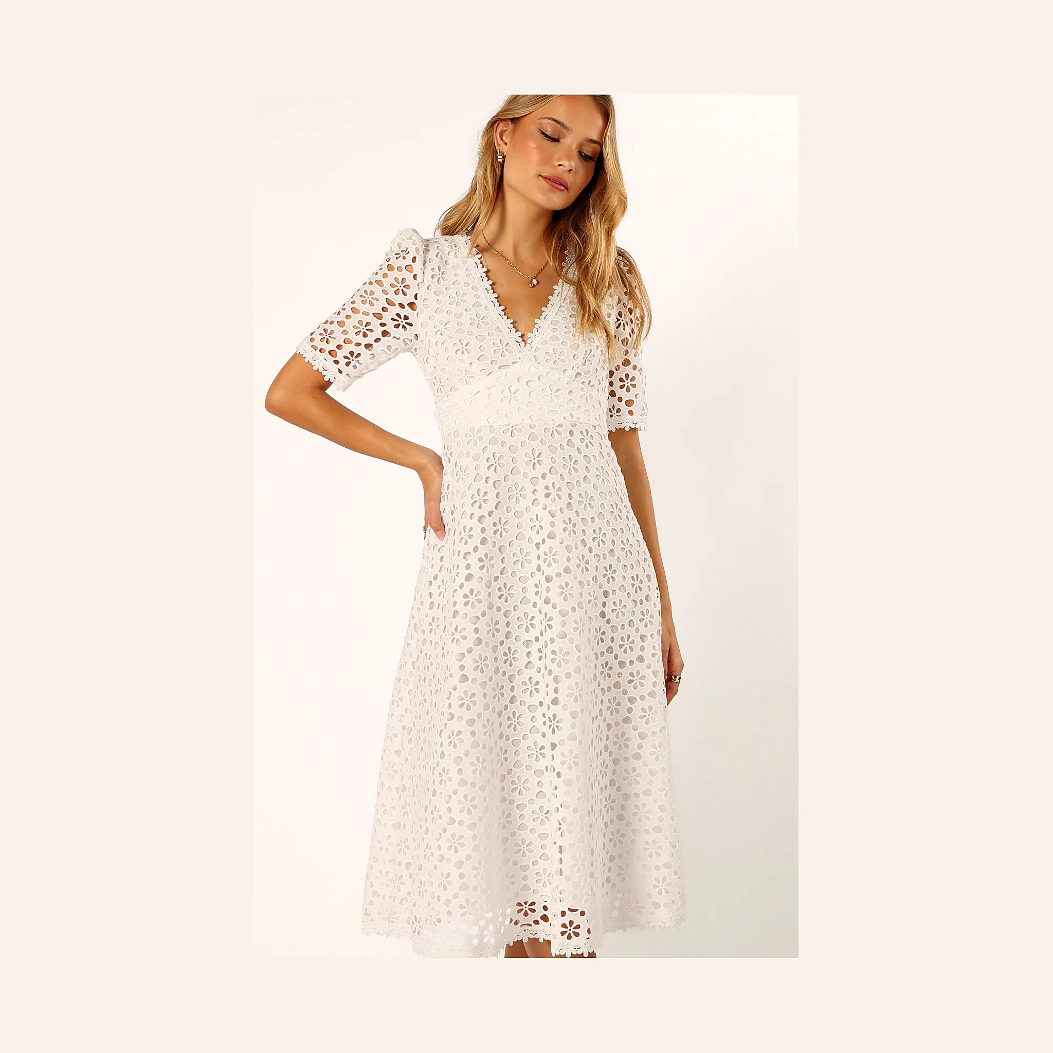 Embroidered white cotton dress with a V overlay neckline