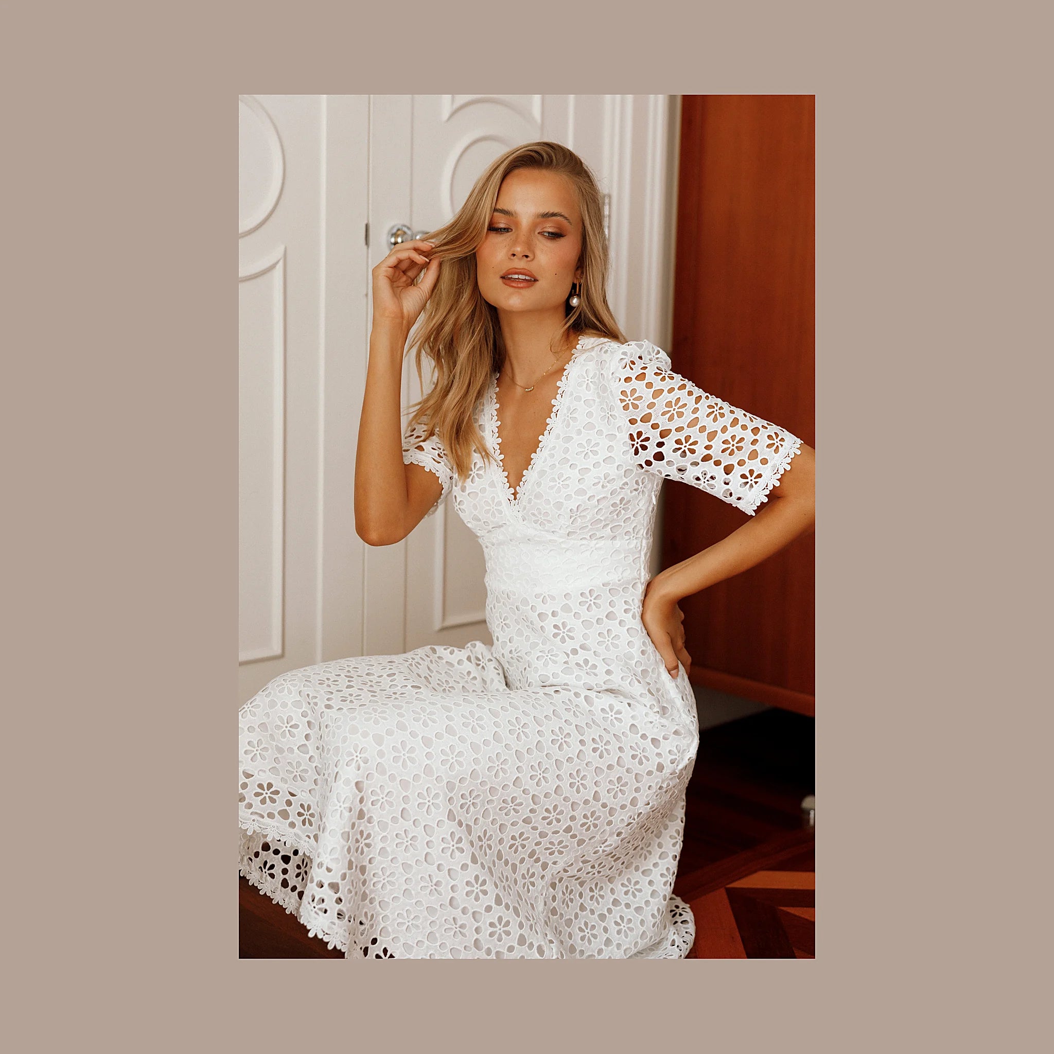 Mid-length white dress with short sleeves and an A-line skirt