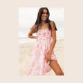 Pink floral strapless midi dress with a shirred bodice