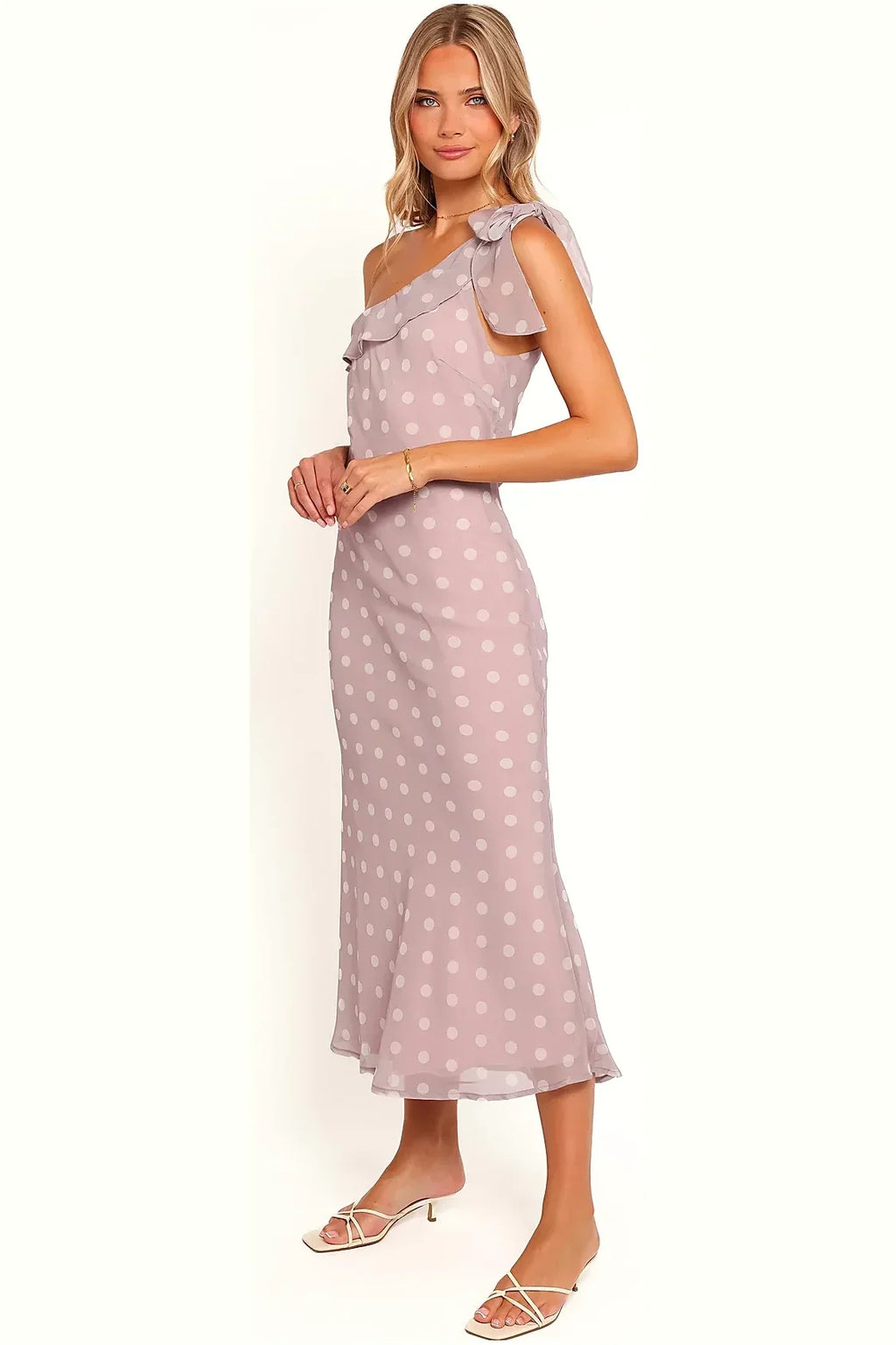 Close-up of the polka dot print and one-shoulder strap