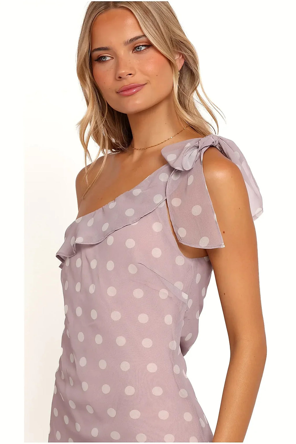 Back view of a long lavender polka dot dress