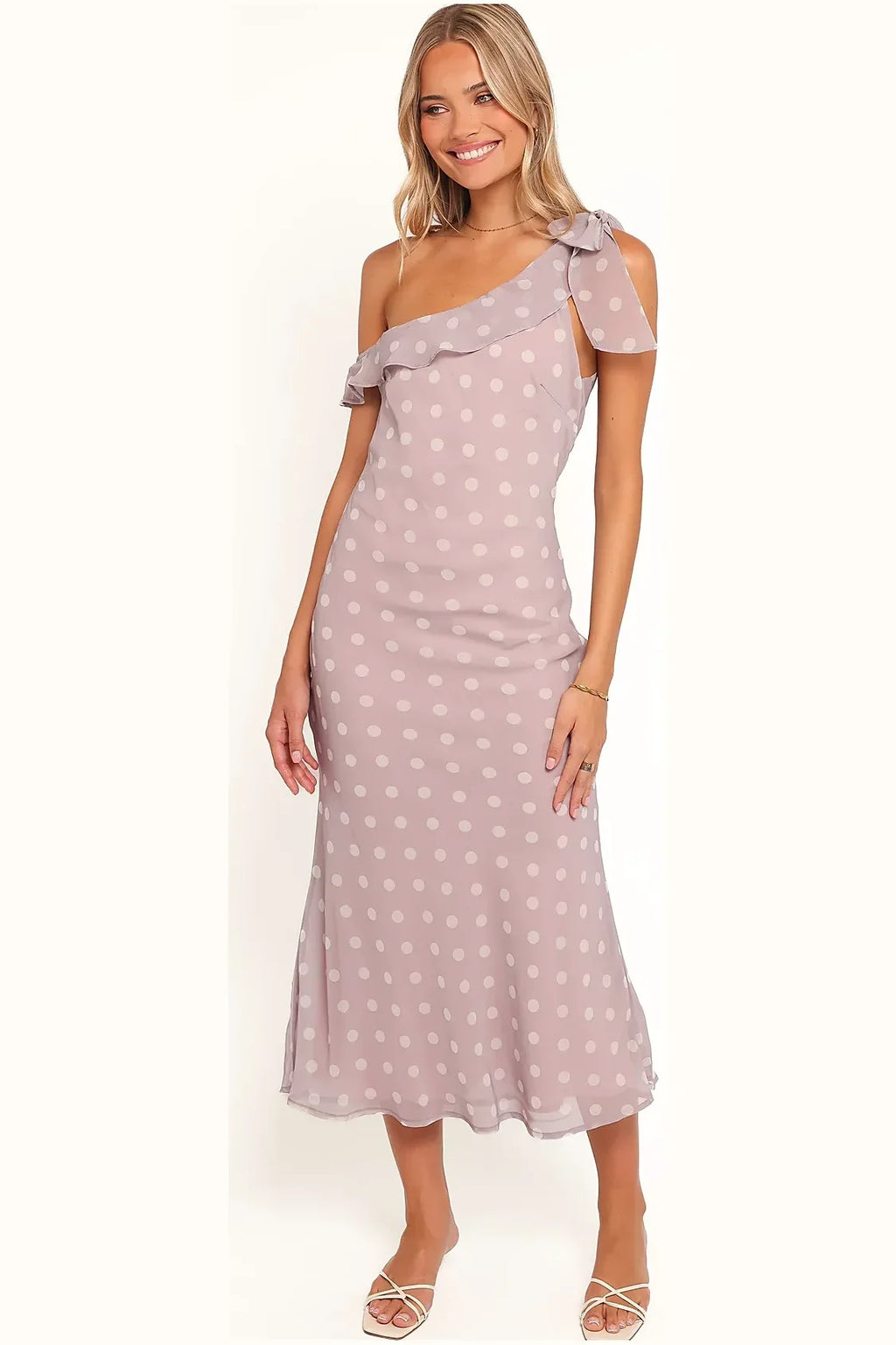One-shoulder lavender polka dot gown seen from the side
