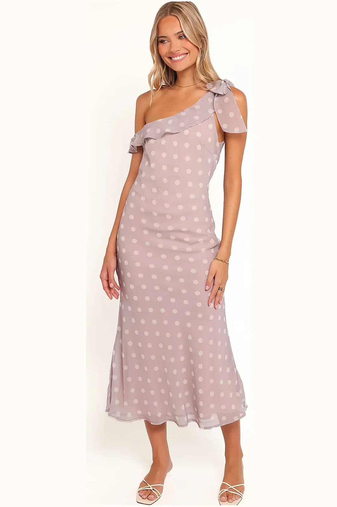 One-shoulder lavender polka dot gown seen from the side