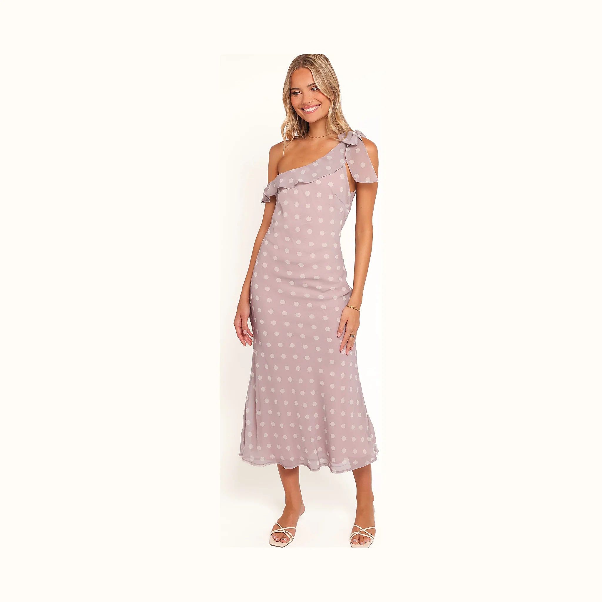 Long purple spotted dress with an asymmetrical cut