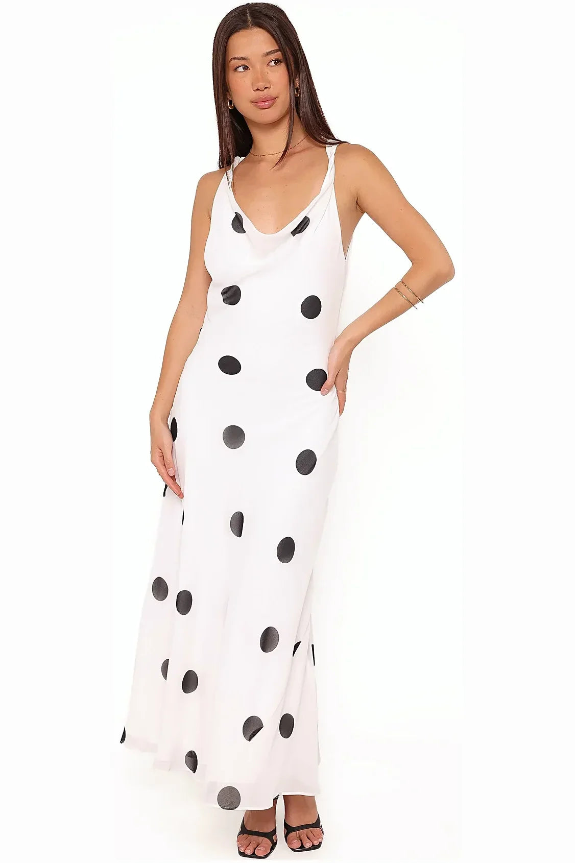 Model wearing the white polka dot maxi dress