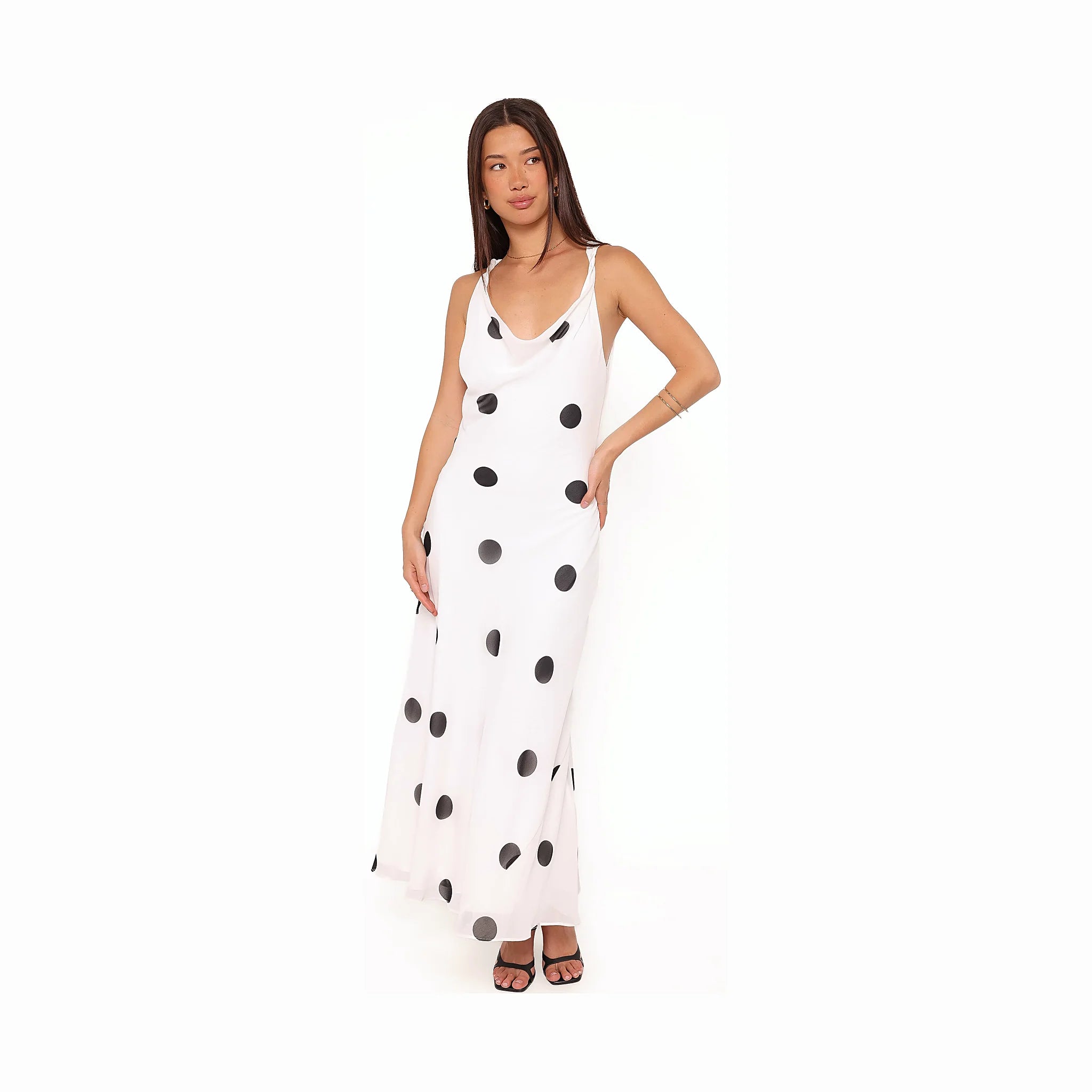 Long white dress with dark spots across a white ground