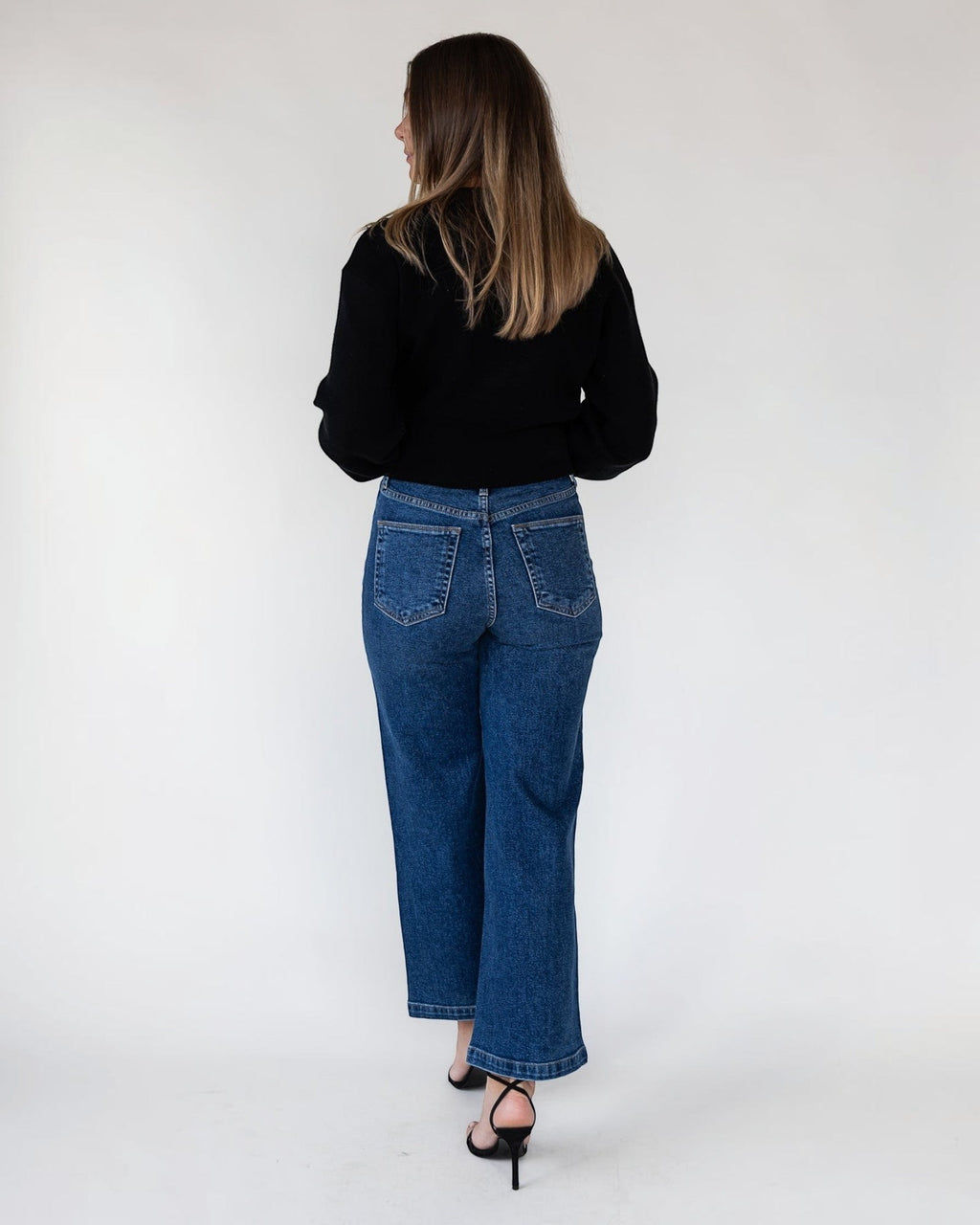 Relaxed cropped fit on a lightweight unlined black cardigan