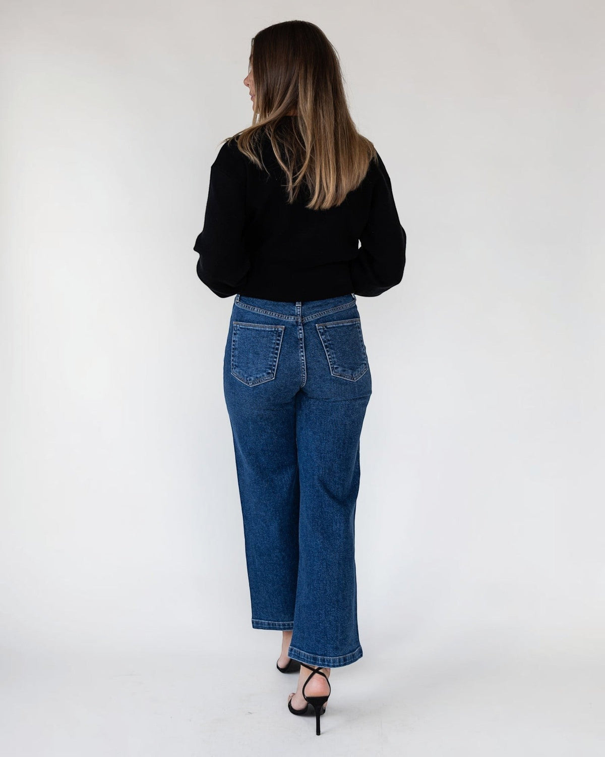 Relaxed cropped fit on a lightweight unlined black cardigan