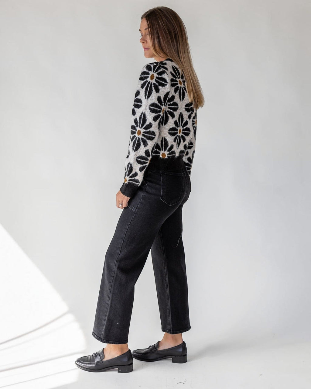 Full button front on a slightly relaxed cropped black knit
