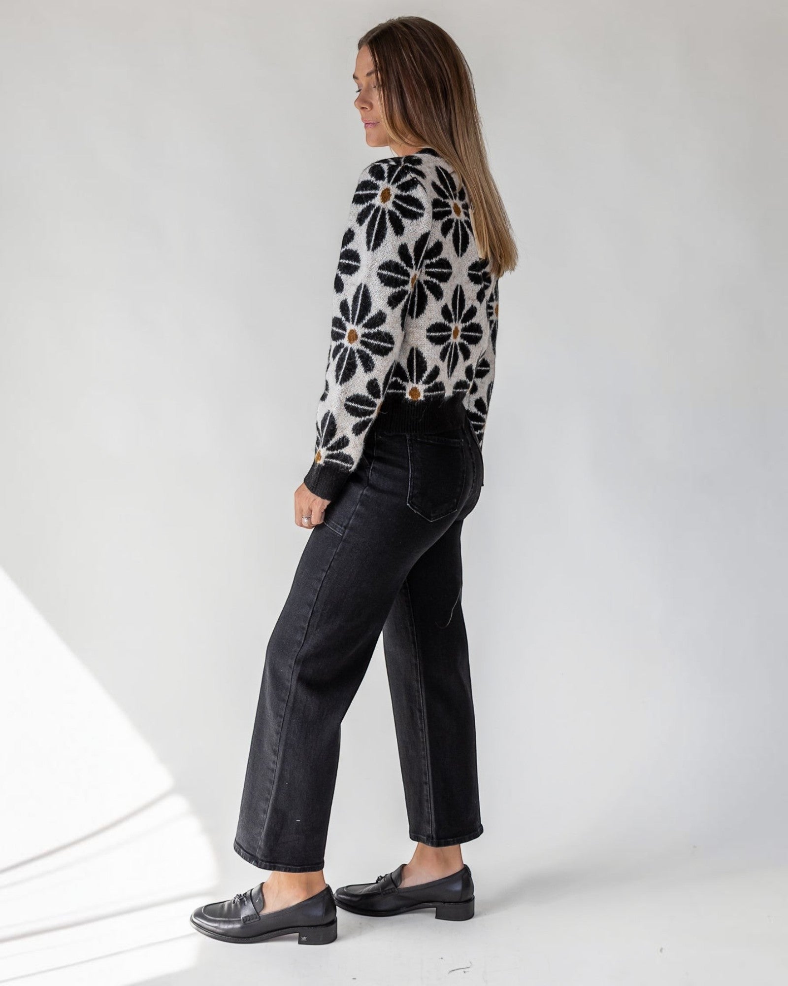 Full button front on a slightly relaxed cropped black knit