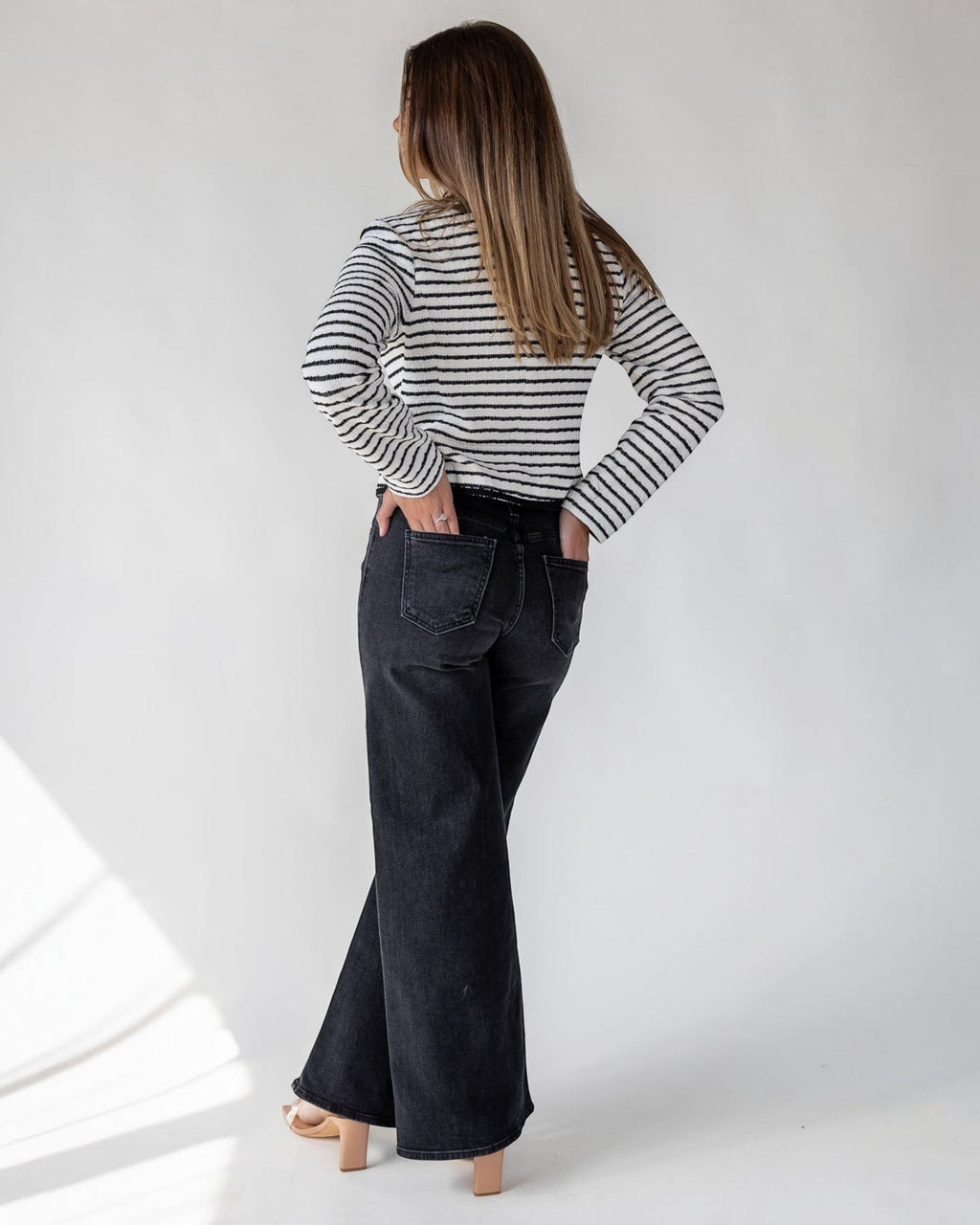 Subtle texture running through the stripe of a soft white knit