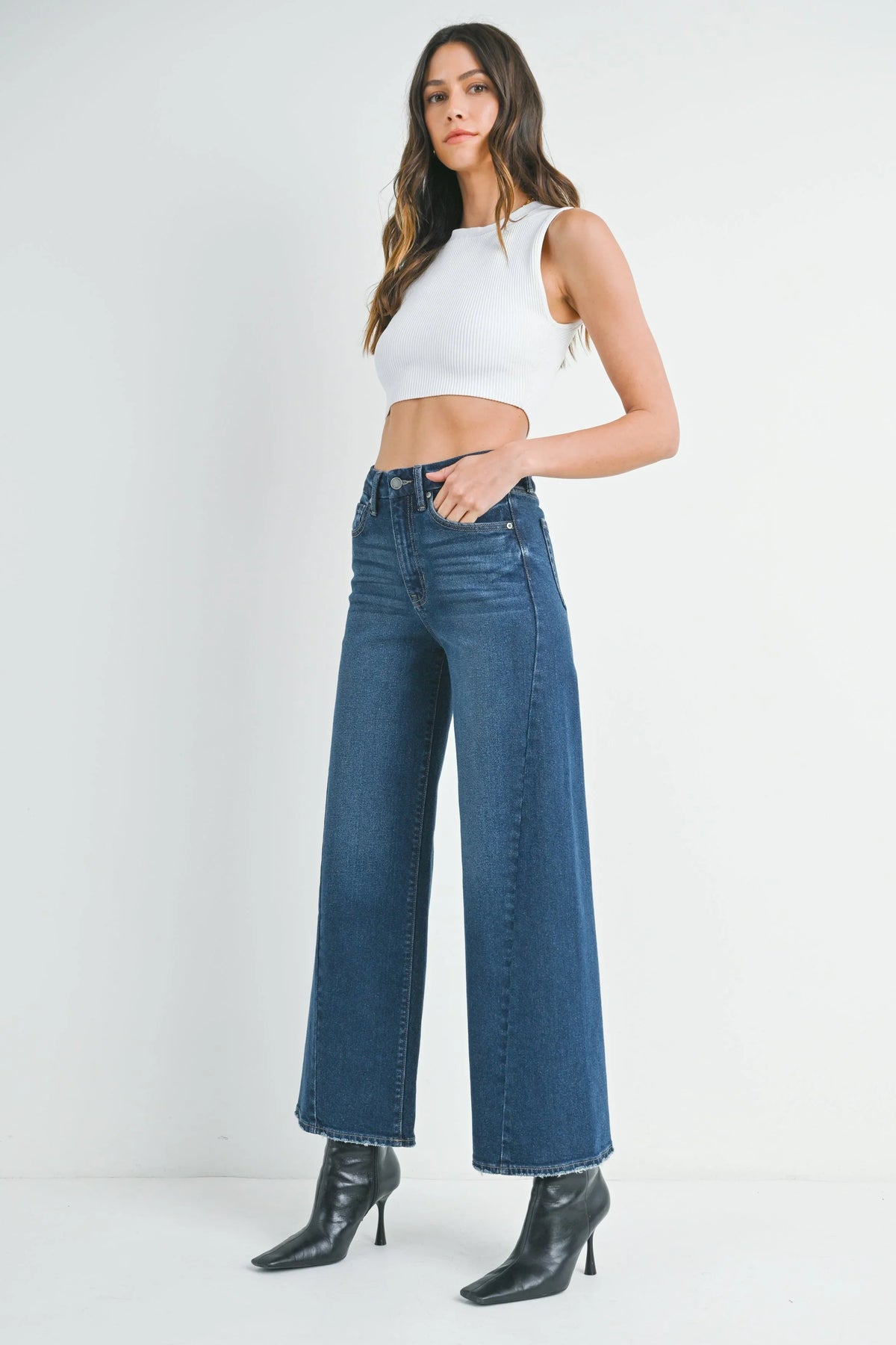 High rise waistband above a full-length wide-leg jean