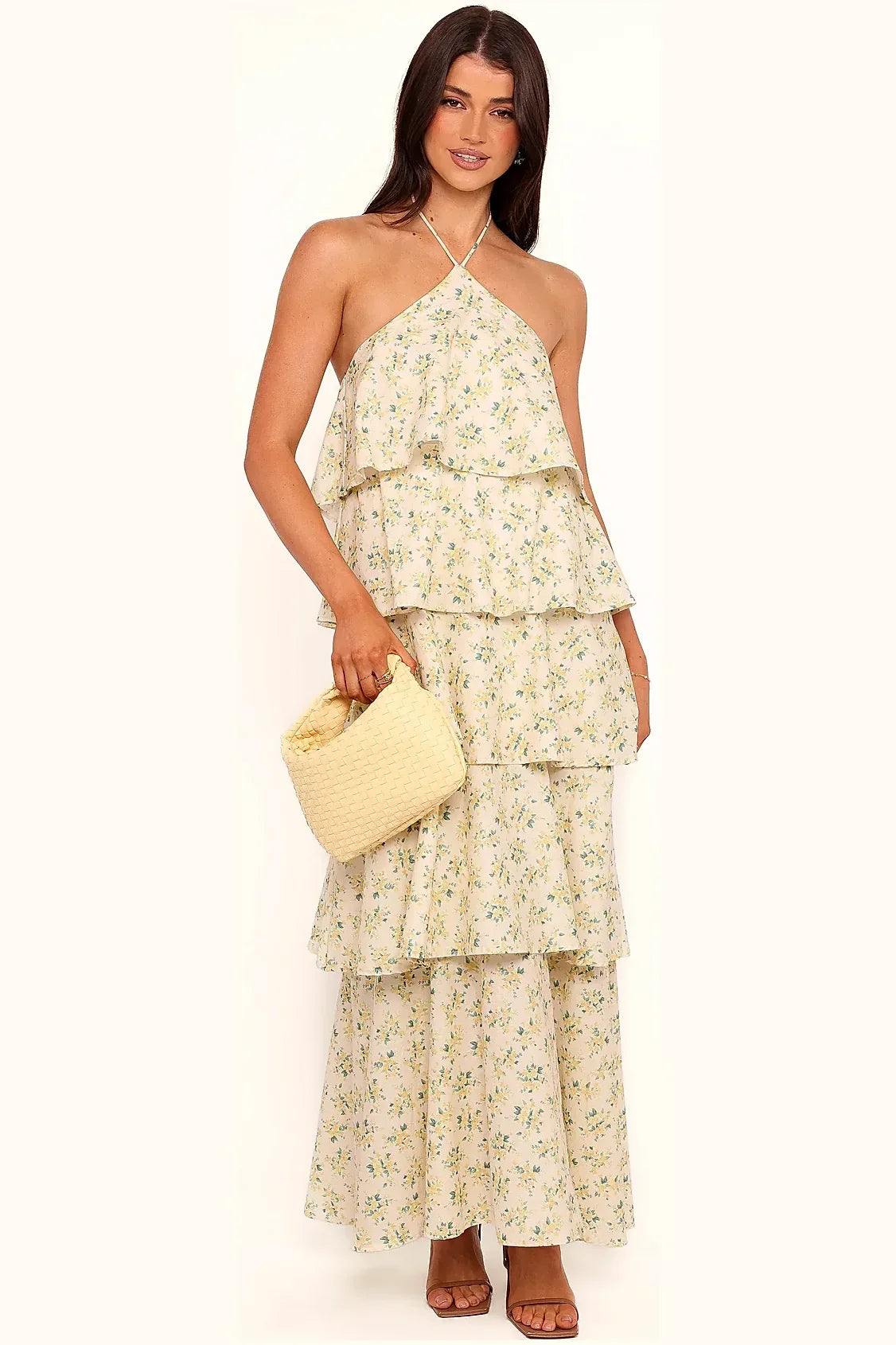 Detail of the tiered cotton skirt on the yellow floral dress