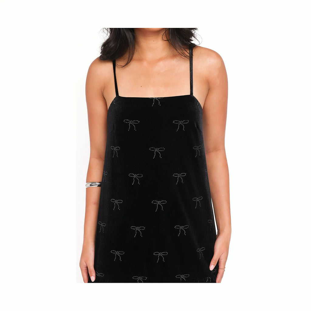 Black velvet mini dress with a square neckline and thin adjustable straps