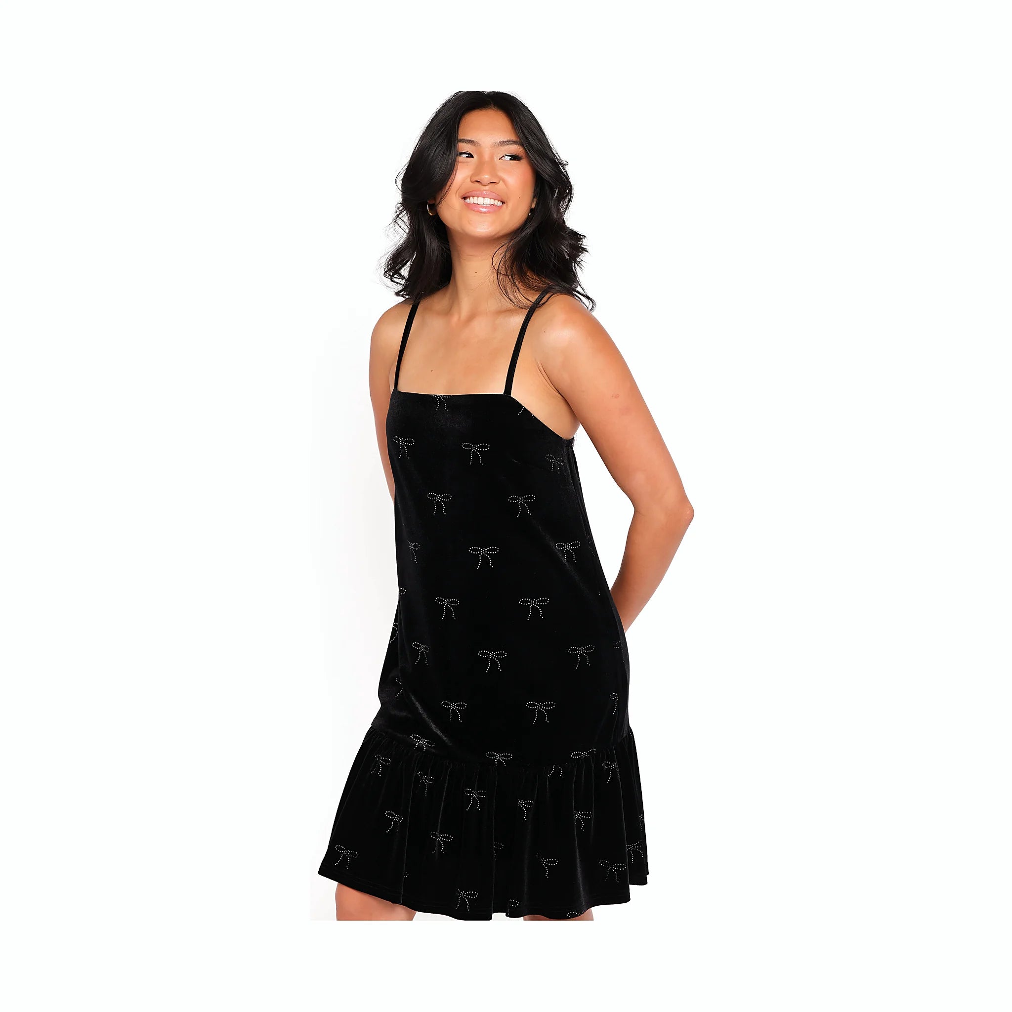 Short black velvet dress with a decorative rhinestone bow detail
