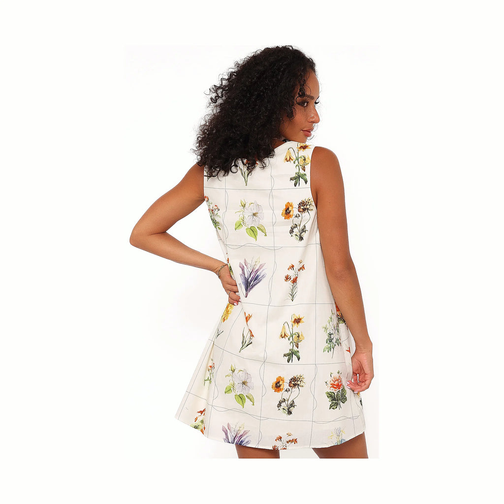 Multicoloured print dress cut to a short hem