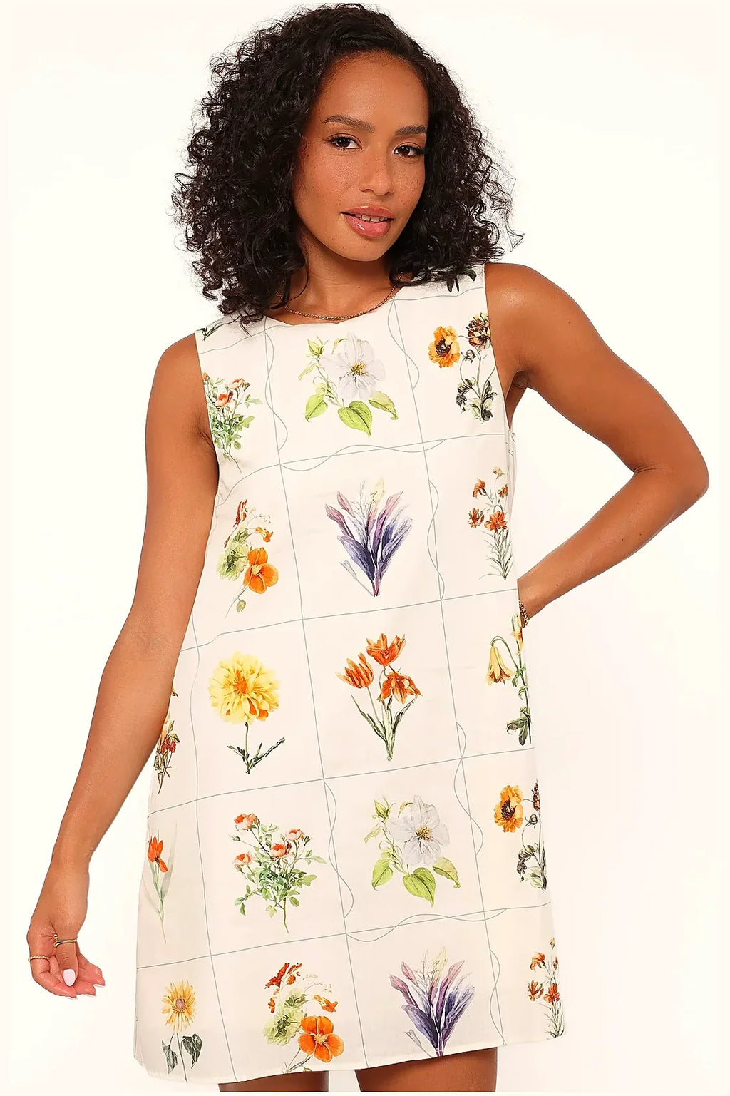 Short flower print dress in bright colours, side view
