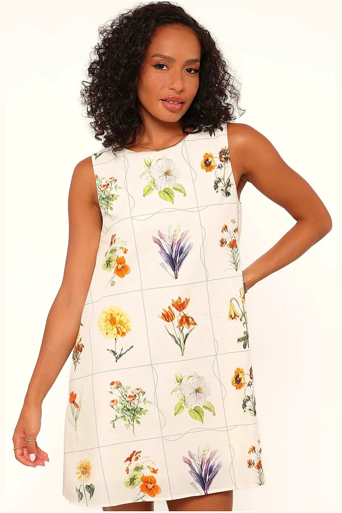 Short flower print dress in bright colours, side view