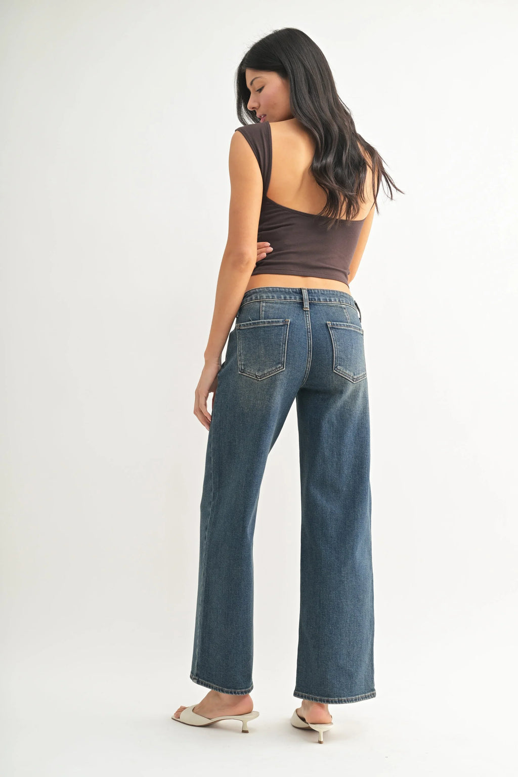 Relaxed line running from hip to hem on faded denim