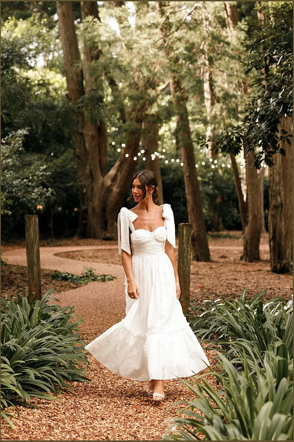 Rear view of the white lace sweetheart maxi dress
