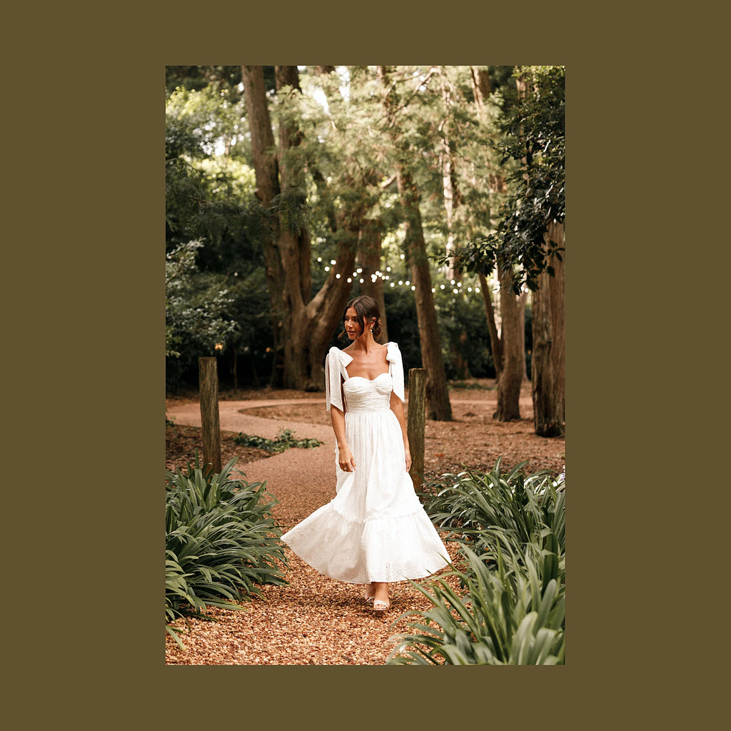Long white dress with a lace overlay and tulle underlay