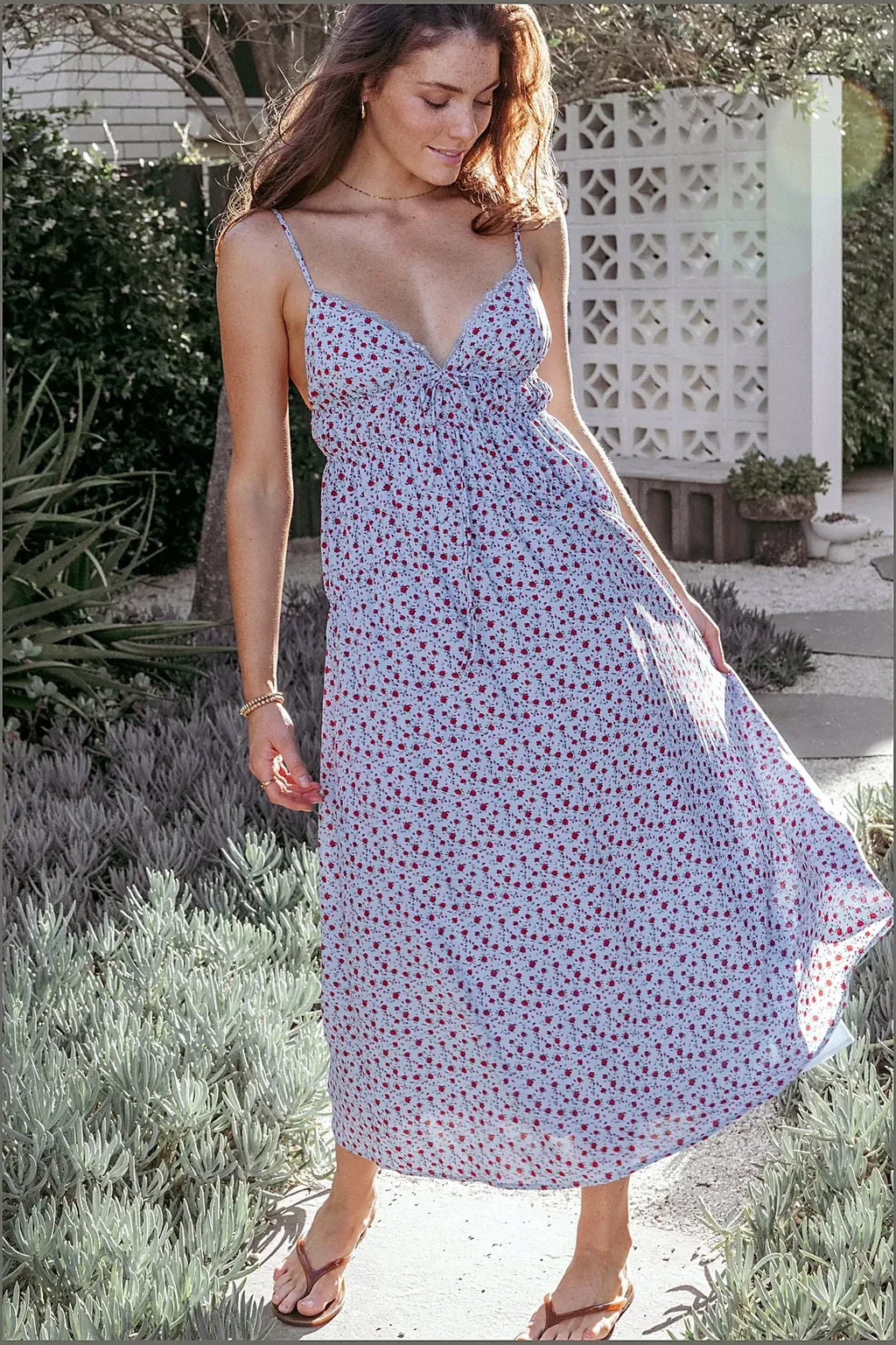 Full-length view of the blue and red floral midi dress