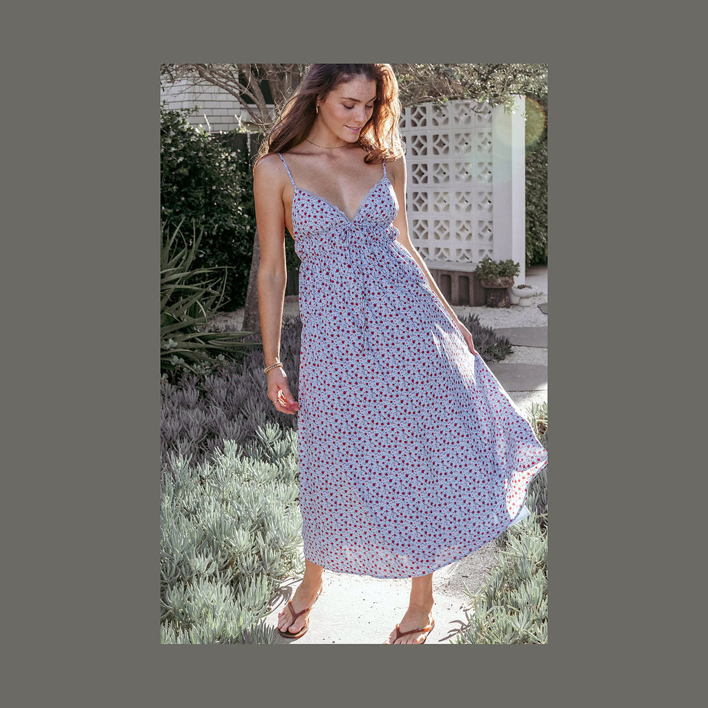 Floral midi dress with thin adjustable straps and an elasticised waistband