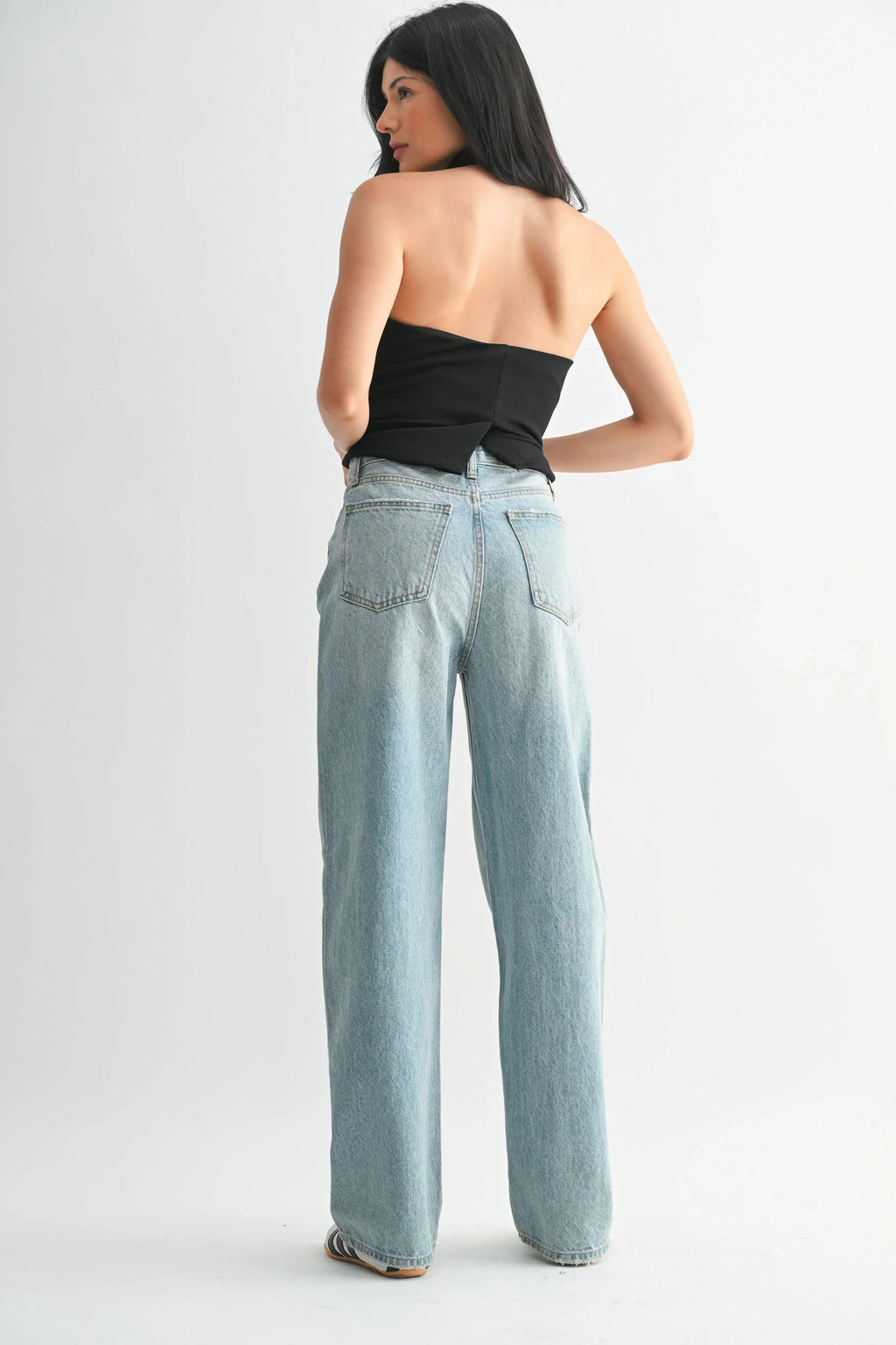 High rise waist above a roomy denim leg