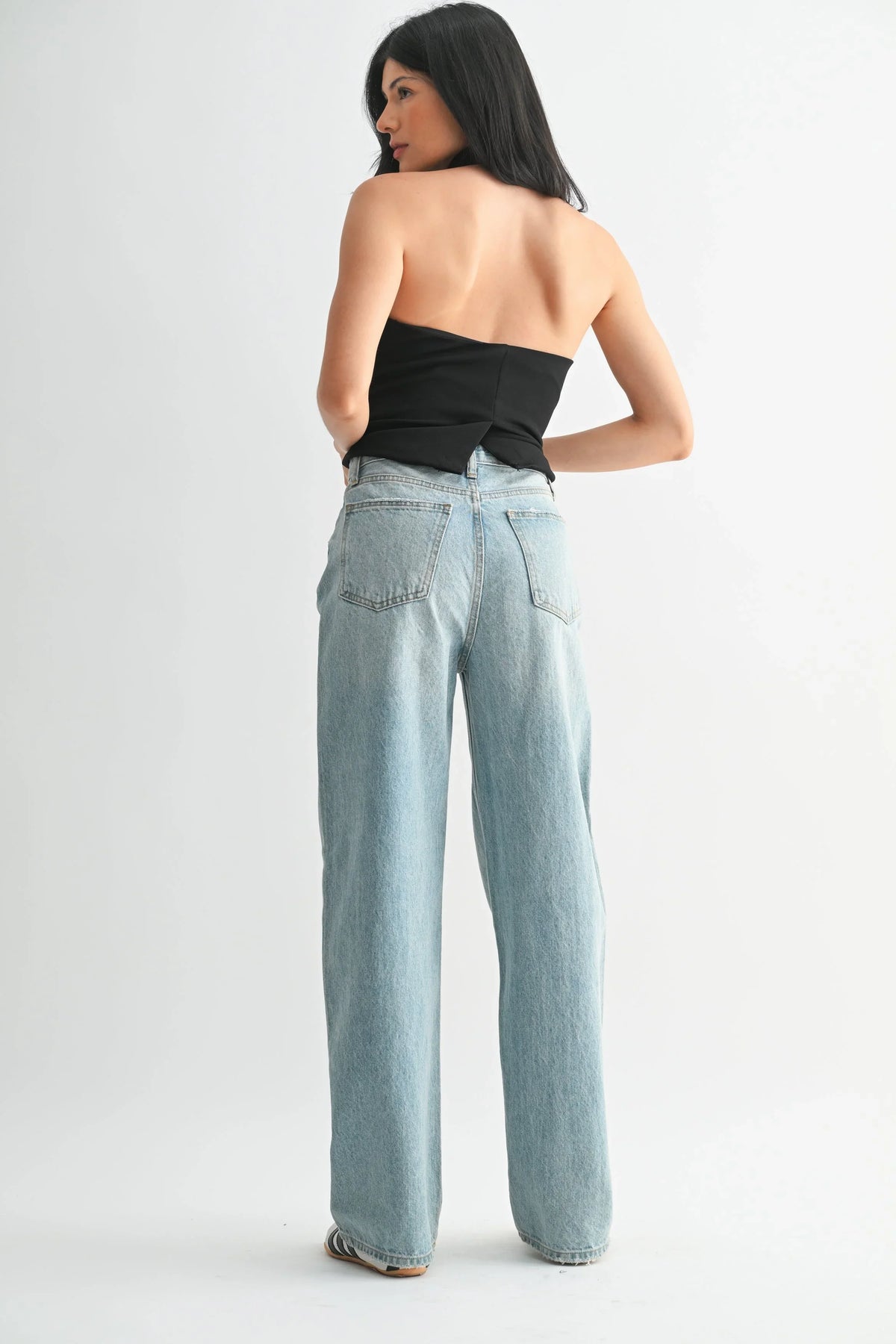 High rise waist above a roomy denim leg