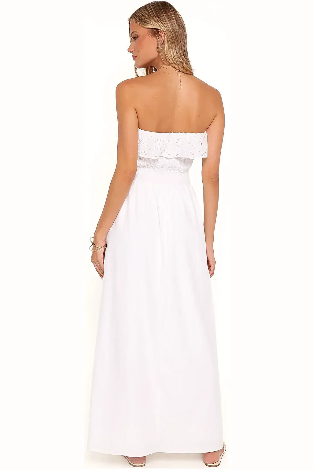 Close-up of the strapless bodice on the white cotton dress