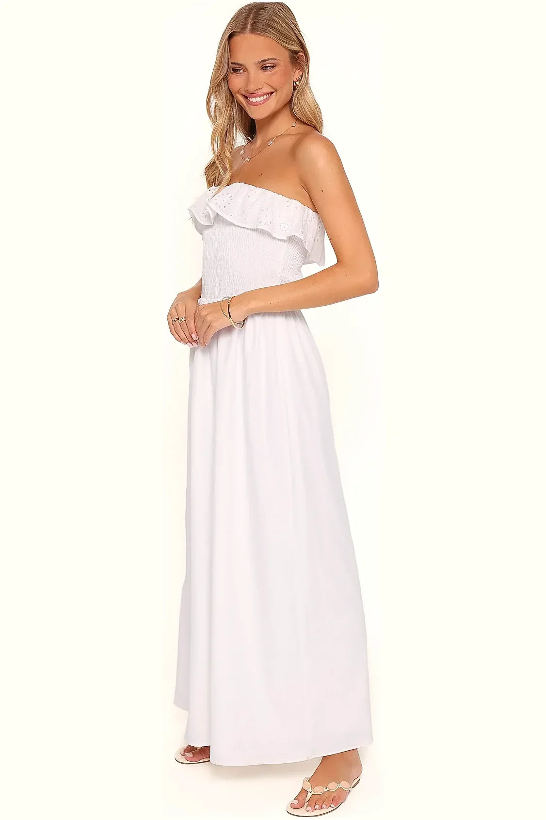Back view of a white cotton strapless maxi dress
