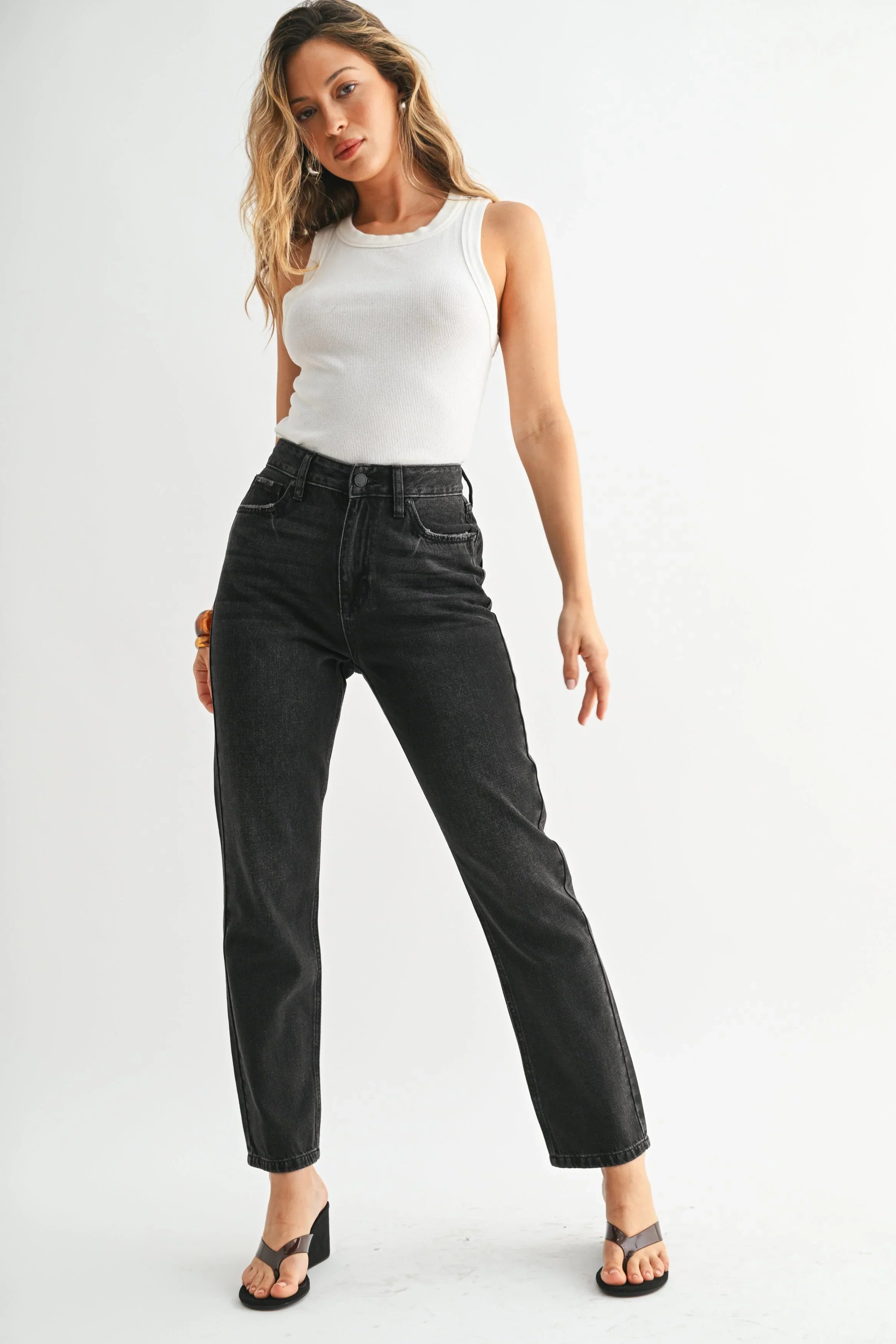 Relaxed mom jean fit through the hips and thighs