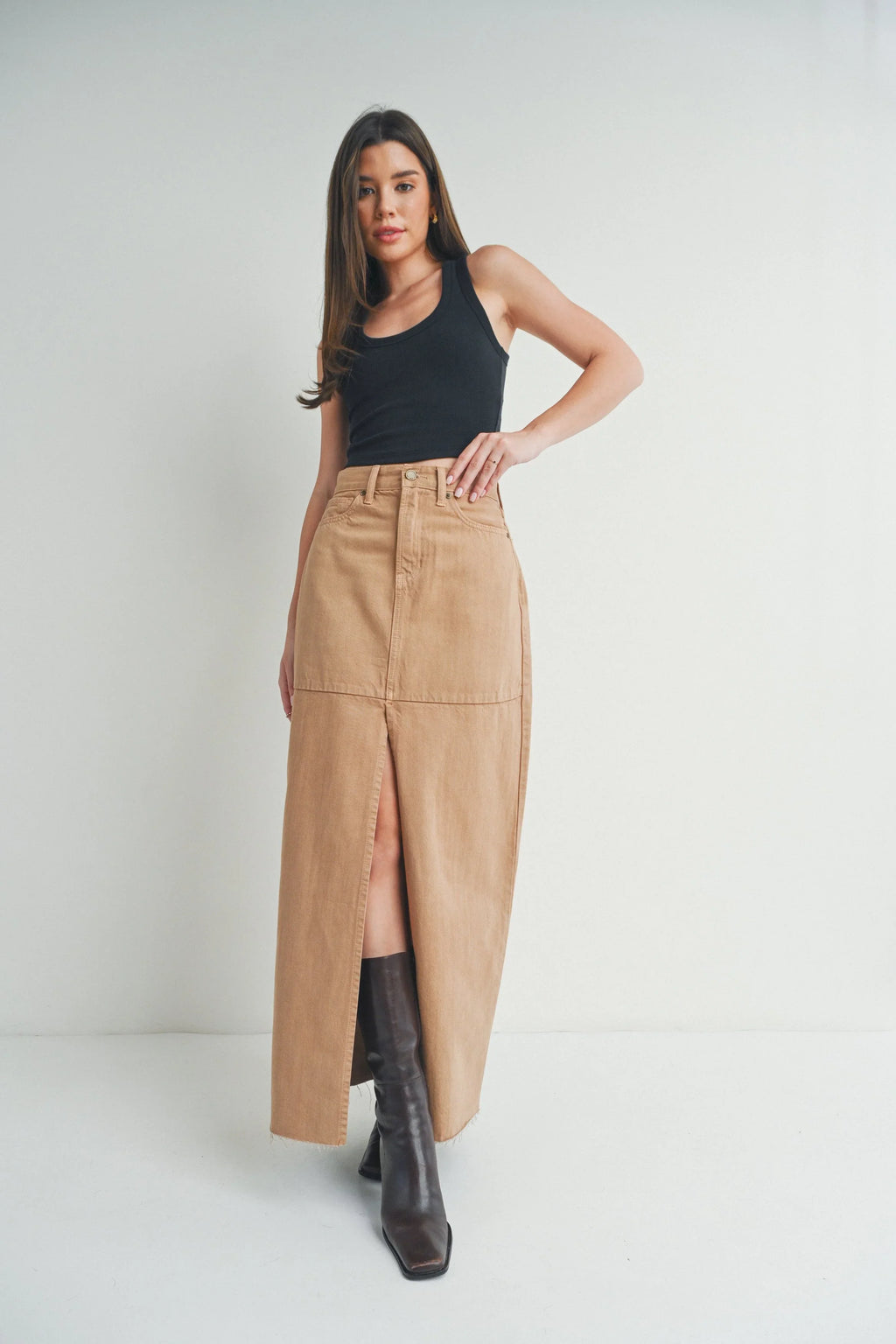 Long front slit opening through a denim maxi skirt