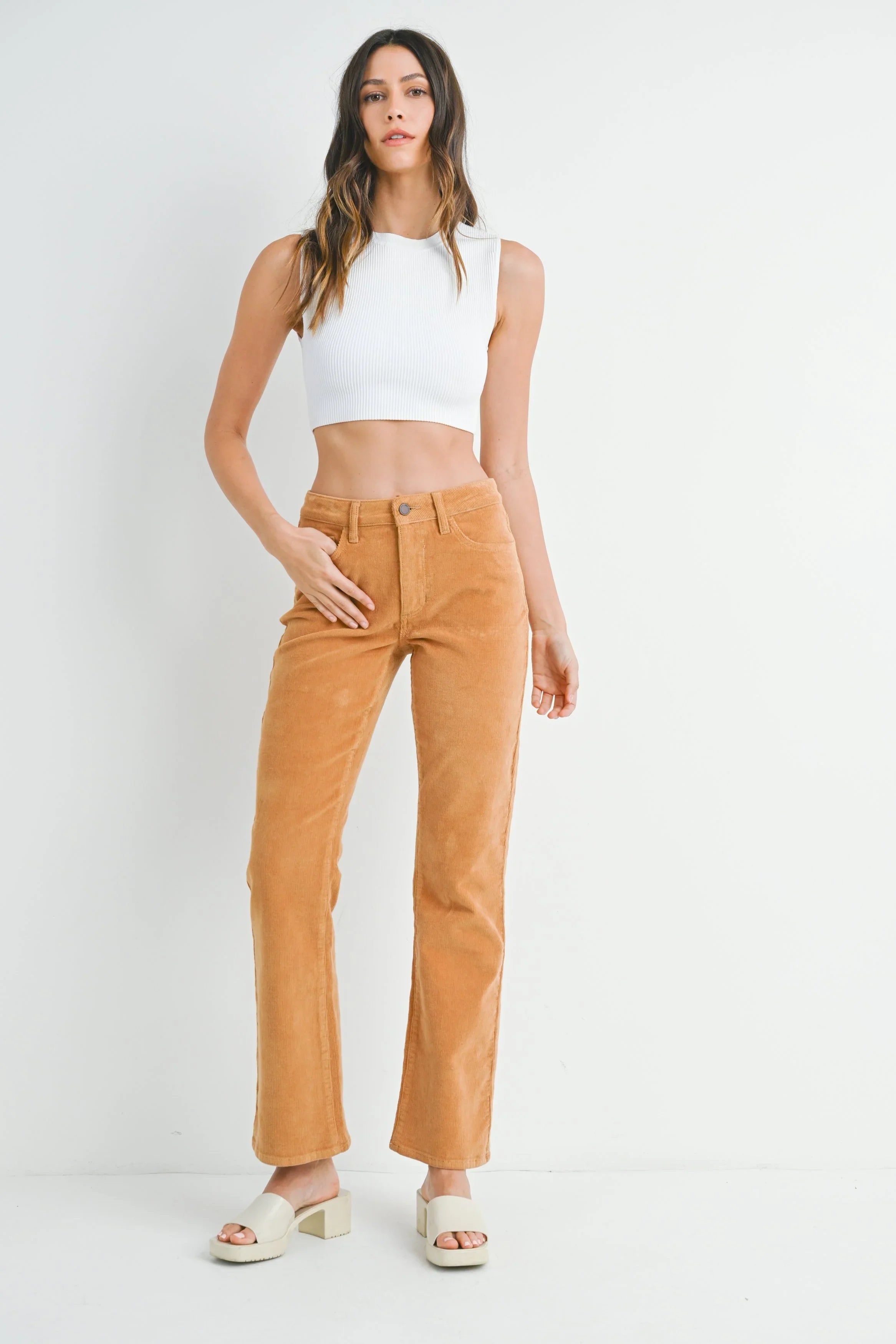Slim bootcut corduroy flaring gently at the ankle