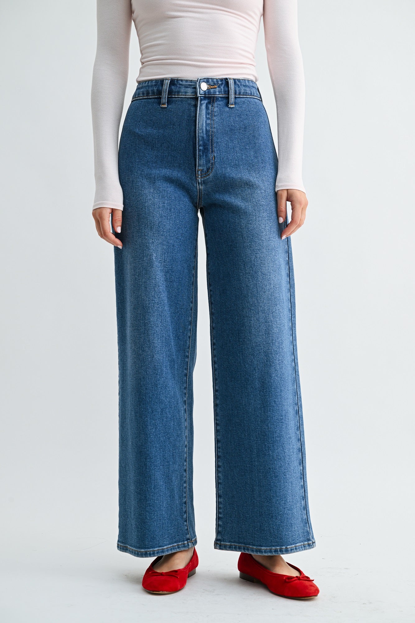 Subtle tailoring details on a black everyday denim trouser