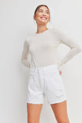 Light distressing adding subtle texture to white denim