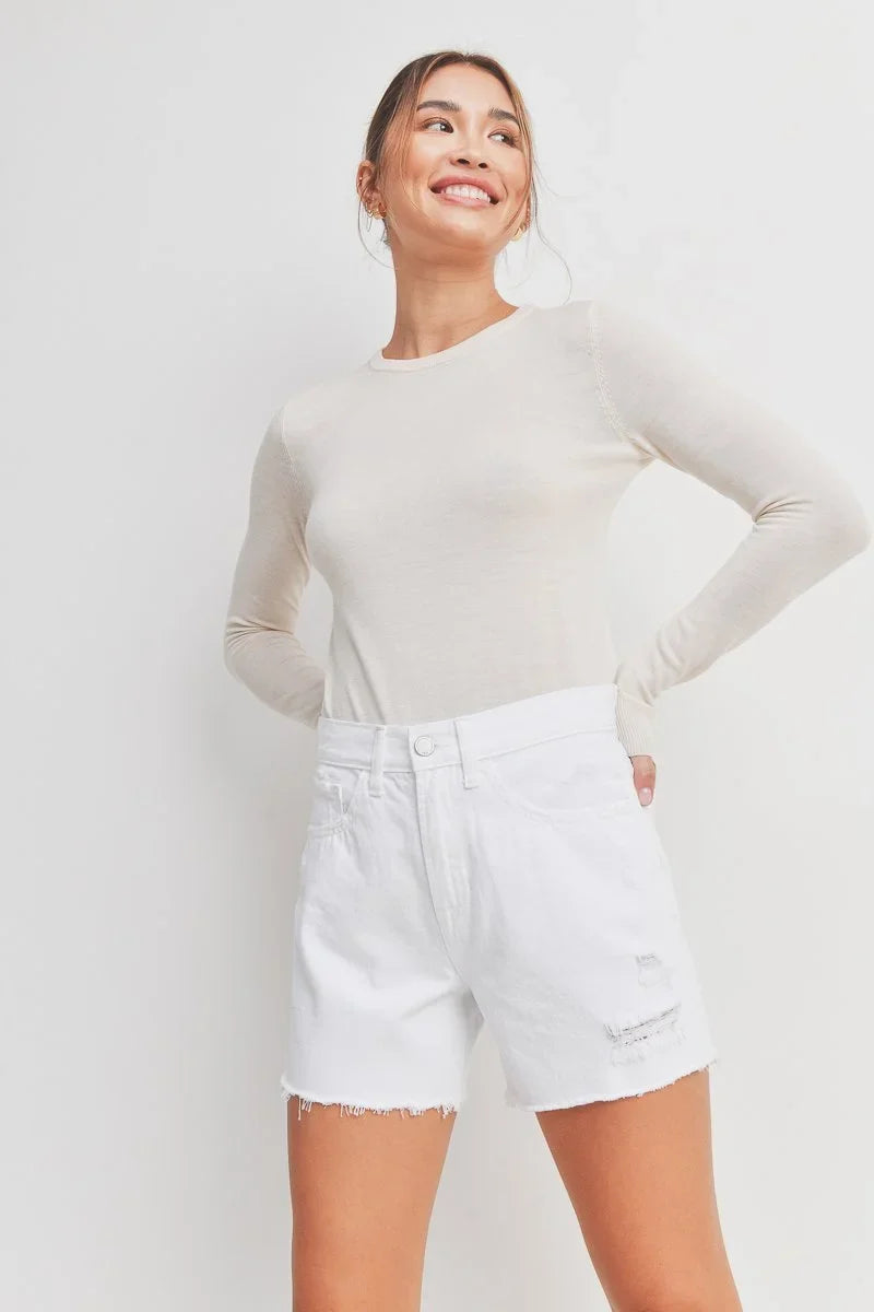 Light distressing adding subtle texture to white denim