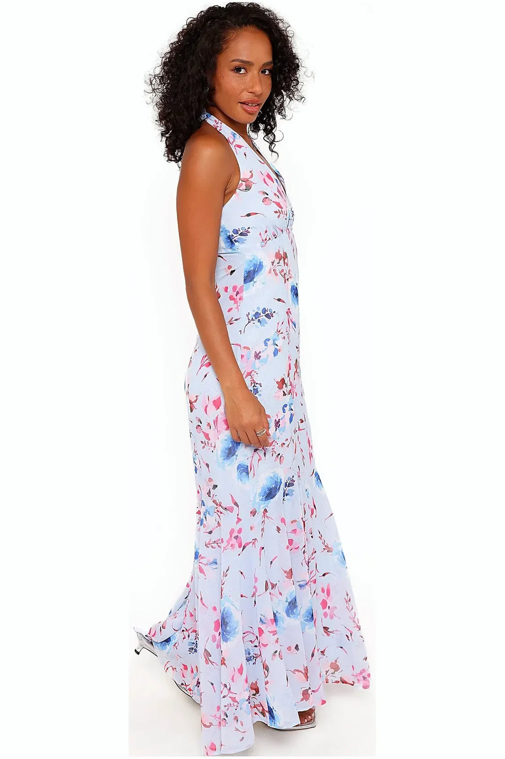 Back view of a long blue floral halterneck dress