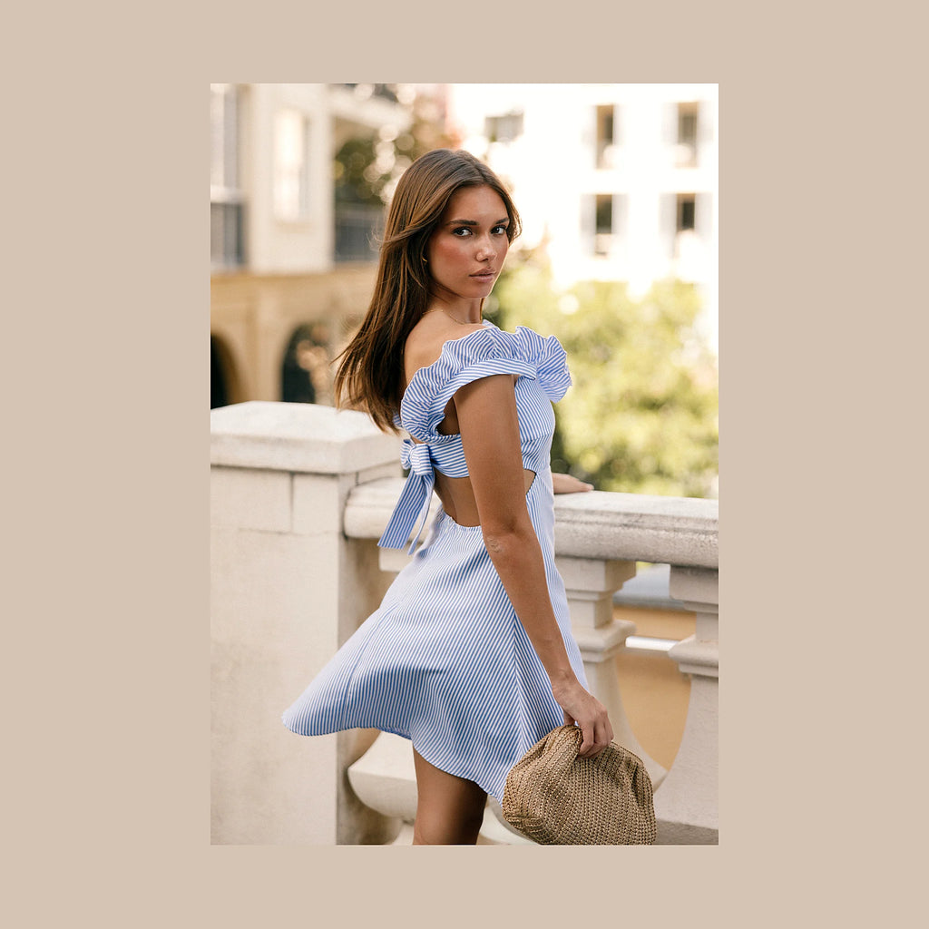 Short striped dress with ruffle detail at the neck