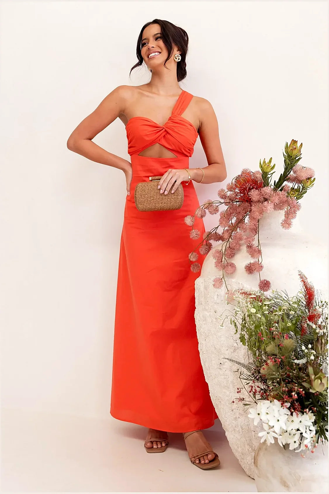 Model wearing the tangerine one-shoulder maxi dress