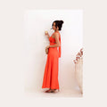 Tangerine one-shoulder maxi dress with an asymmetrical neckline