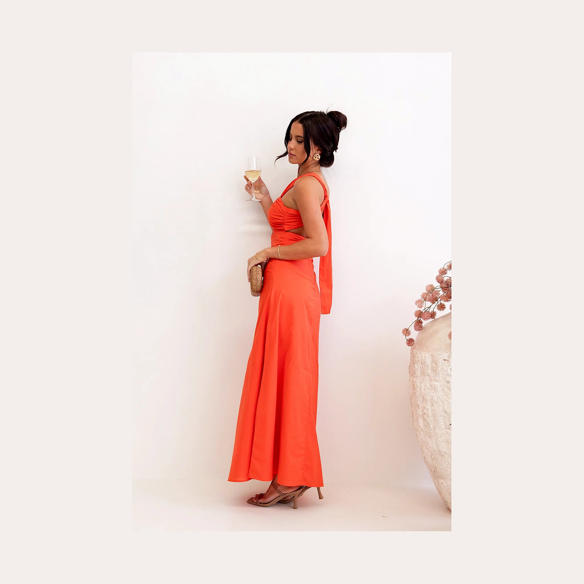 Tangerine one-shoulder maxi dress with an asymmetrical neckline