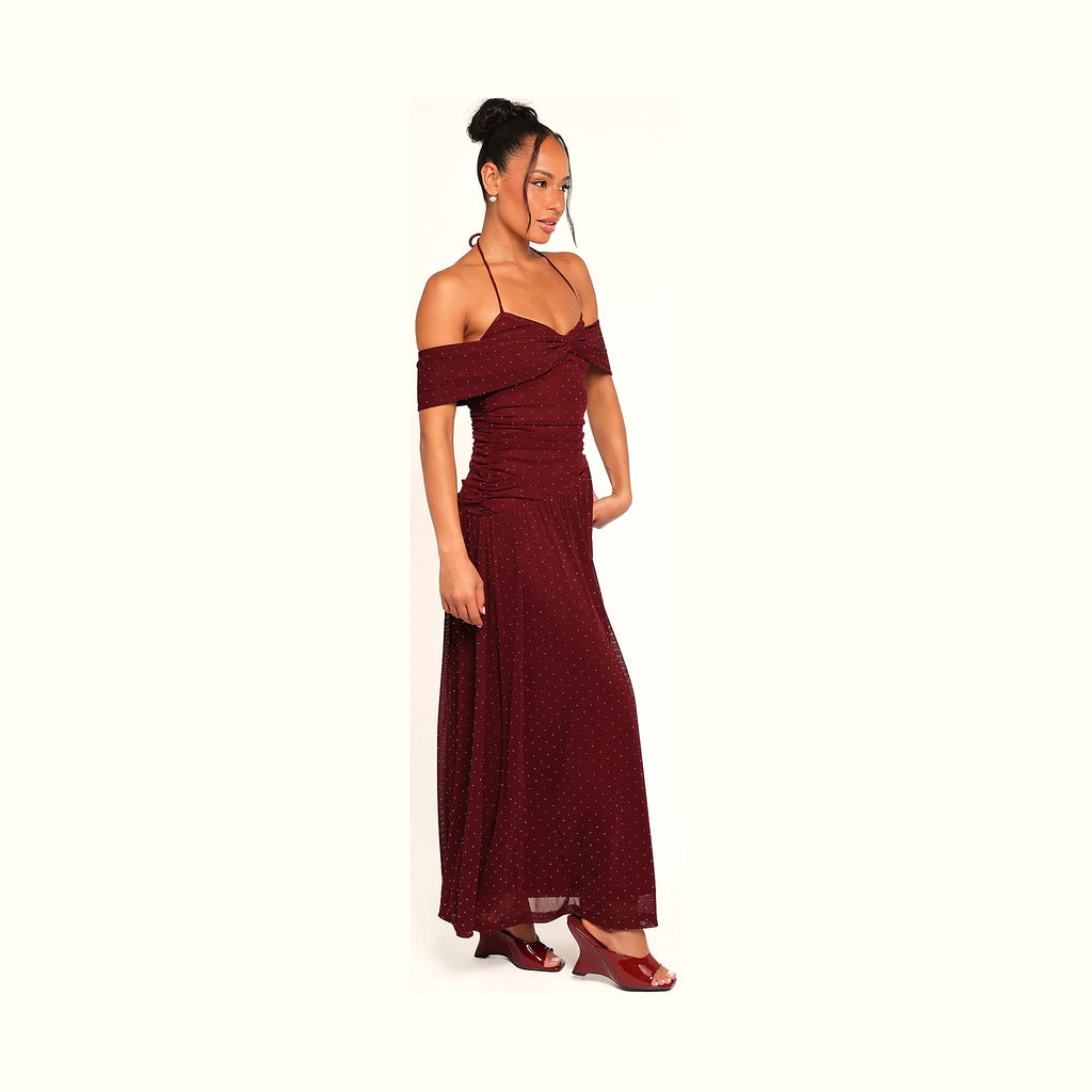 Burgundy halterneck dress in a full-length polka dot print