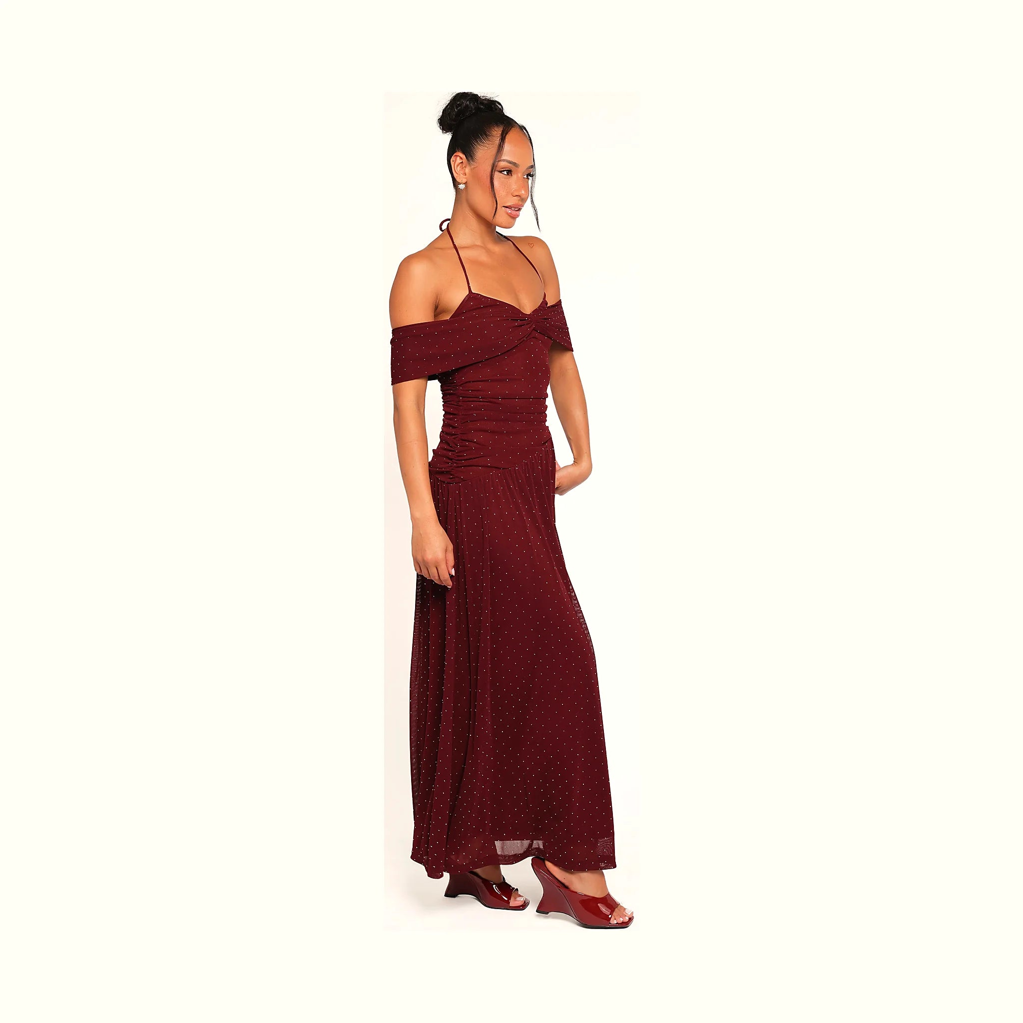 Burgundy halterneck dress in a full-length polka dot print