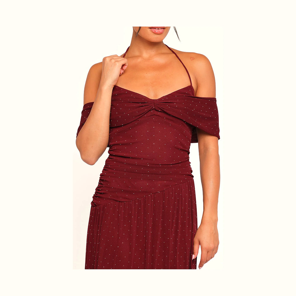 Floor-length polka dot dress with gathered and ruched detail at the waist
