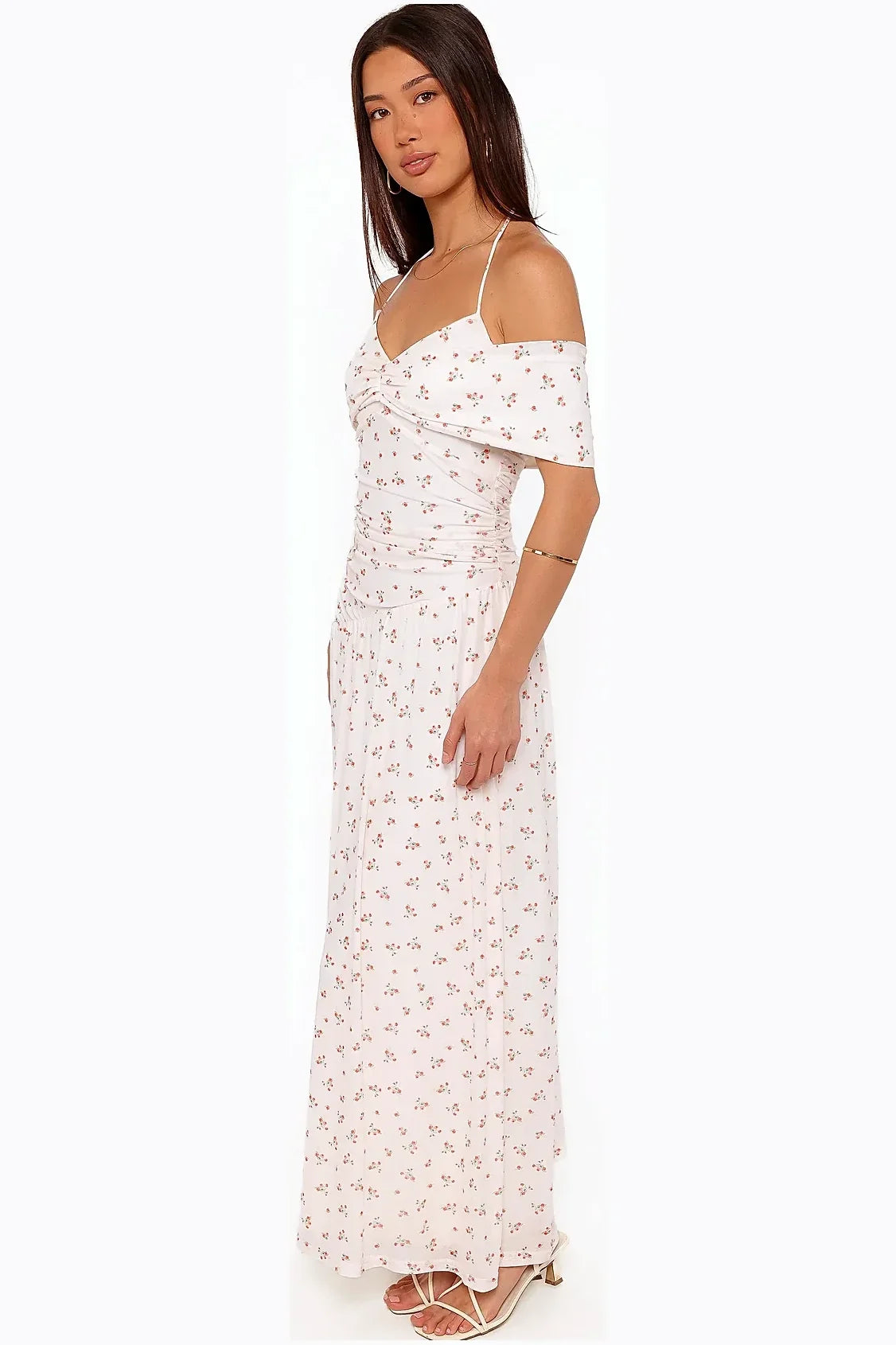 Back view of a white ditsy floral halterneck maxi dress