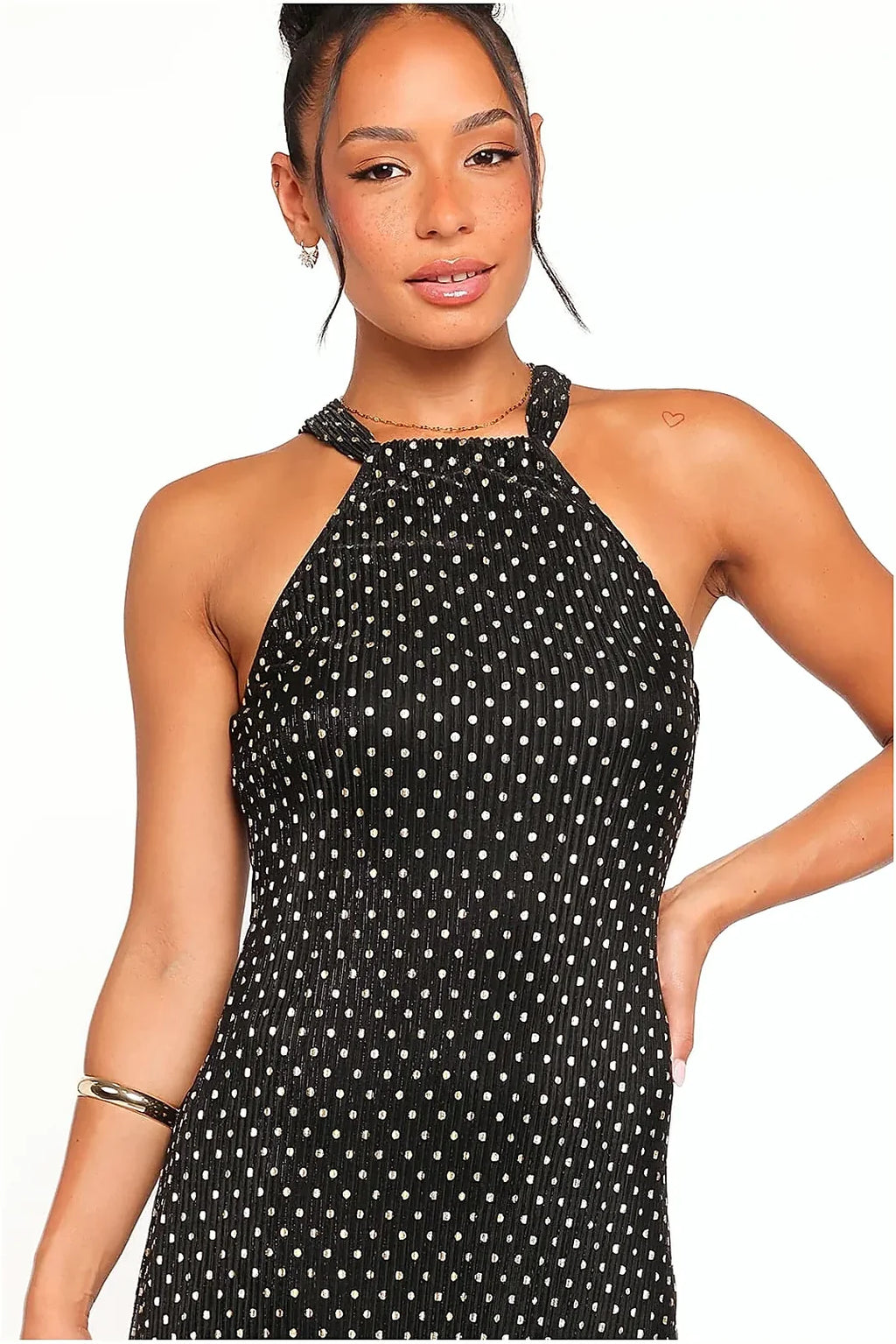 Back view of the black and gold polka dot halter maxi dress